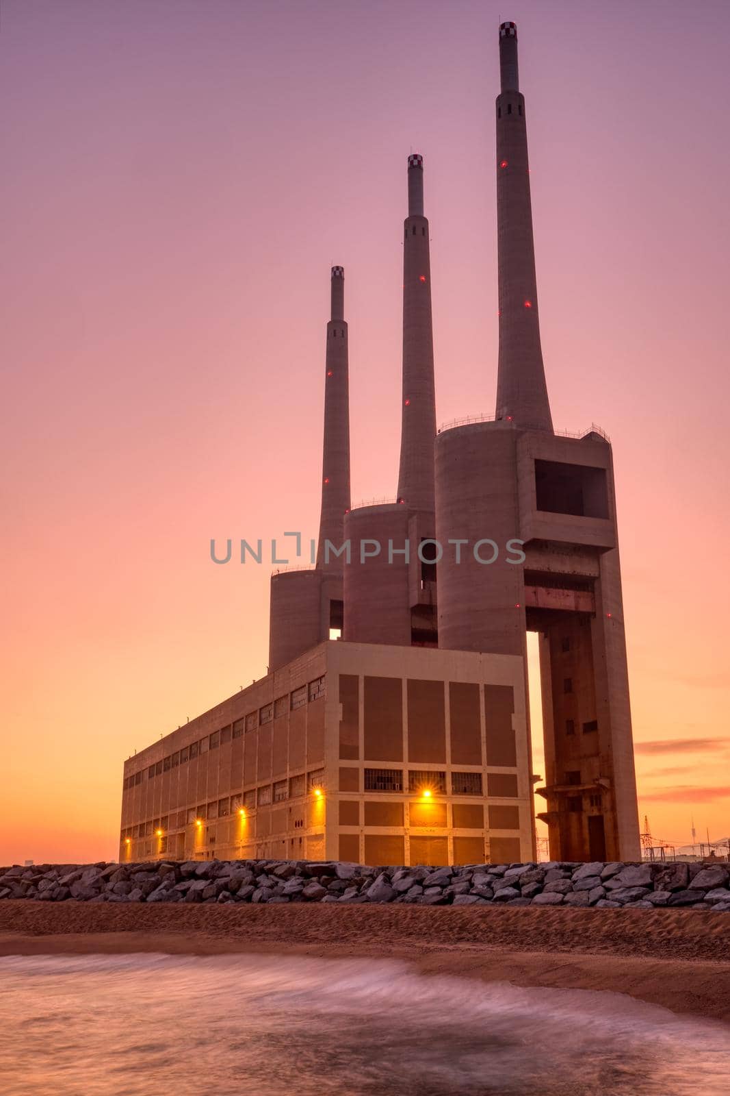 The disused thermal power station at Sand Adria near Barcelona at sunset