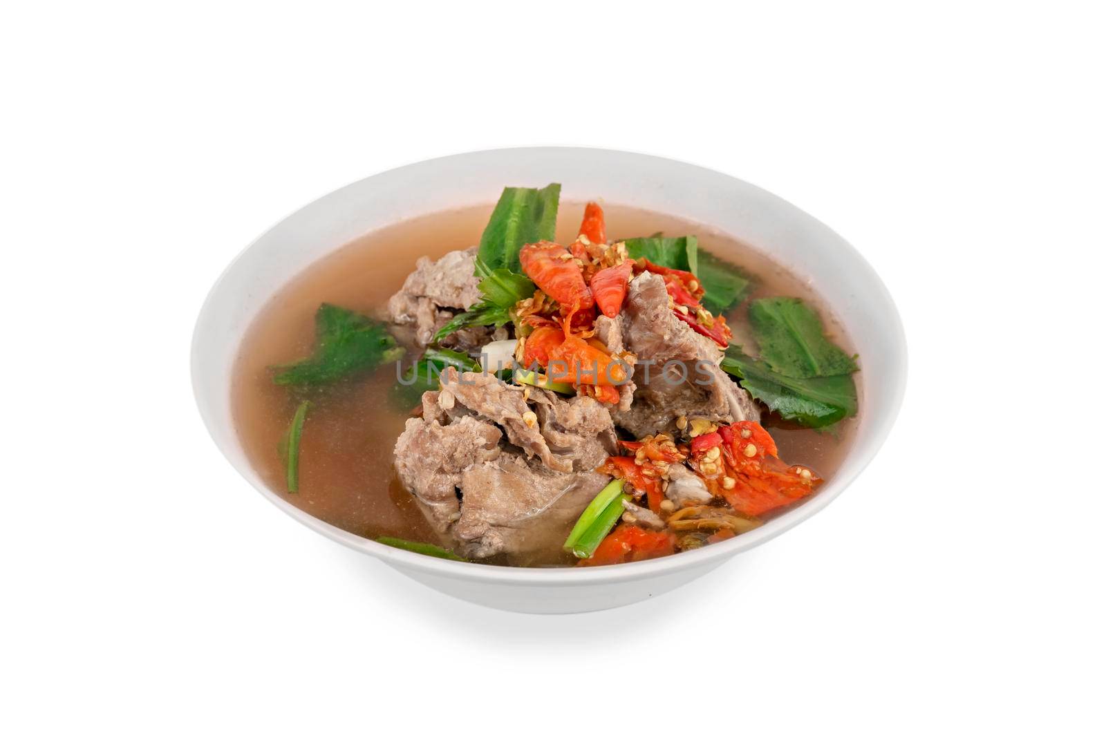 pork bone with chili and vegetables spicy and sour soup  in bowl over white backgrounnd