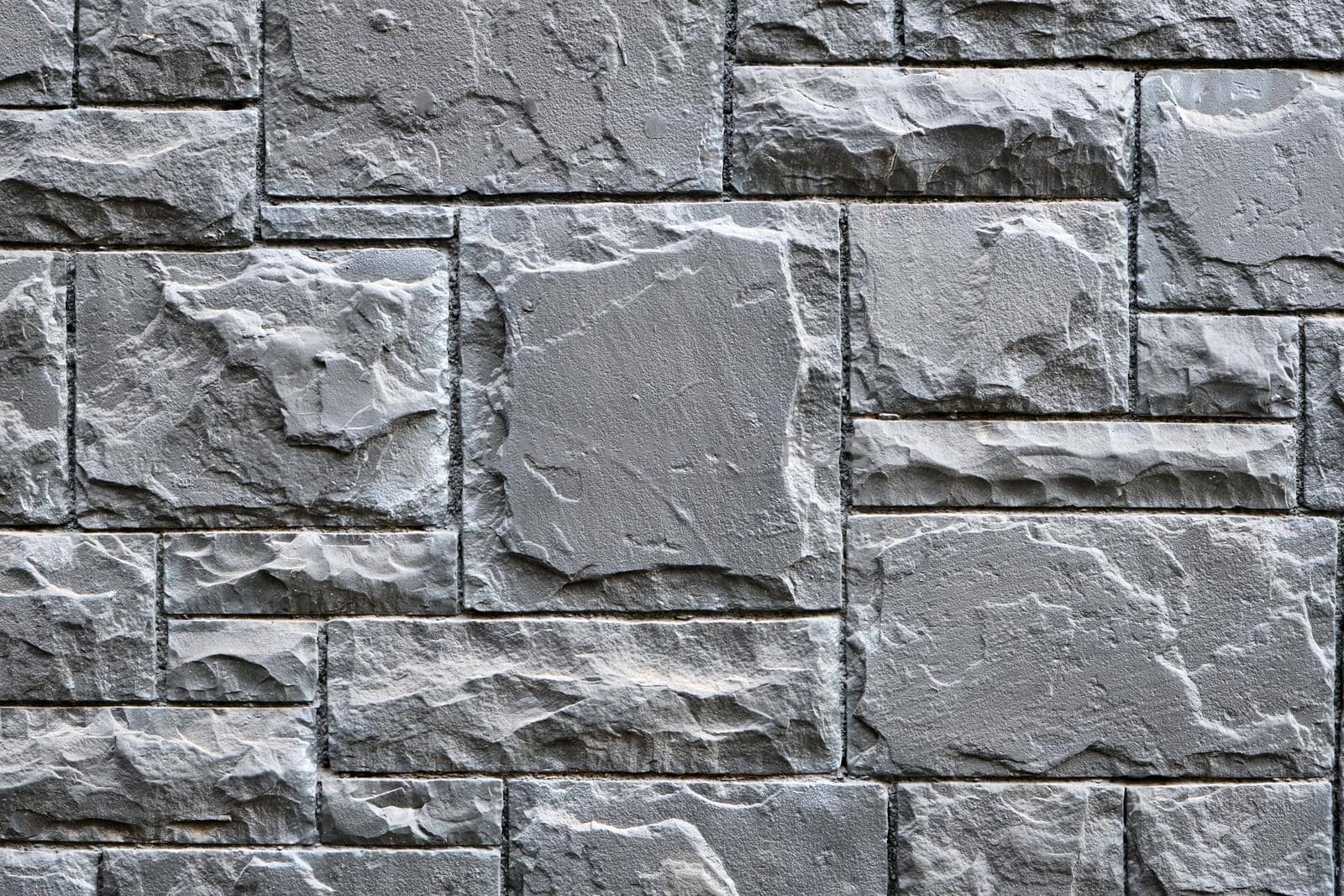 Background from a wall made of gray granite stones