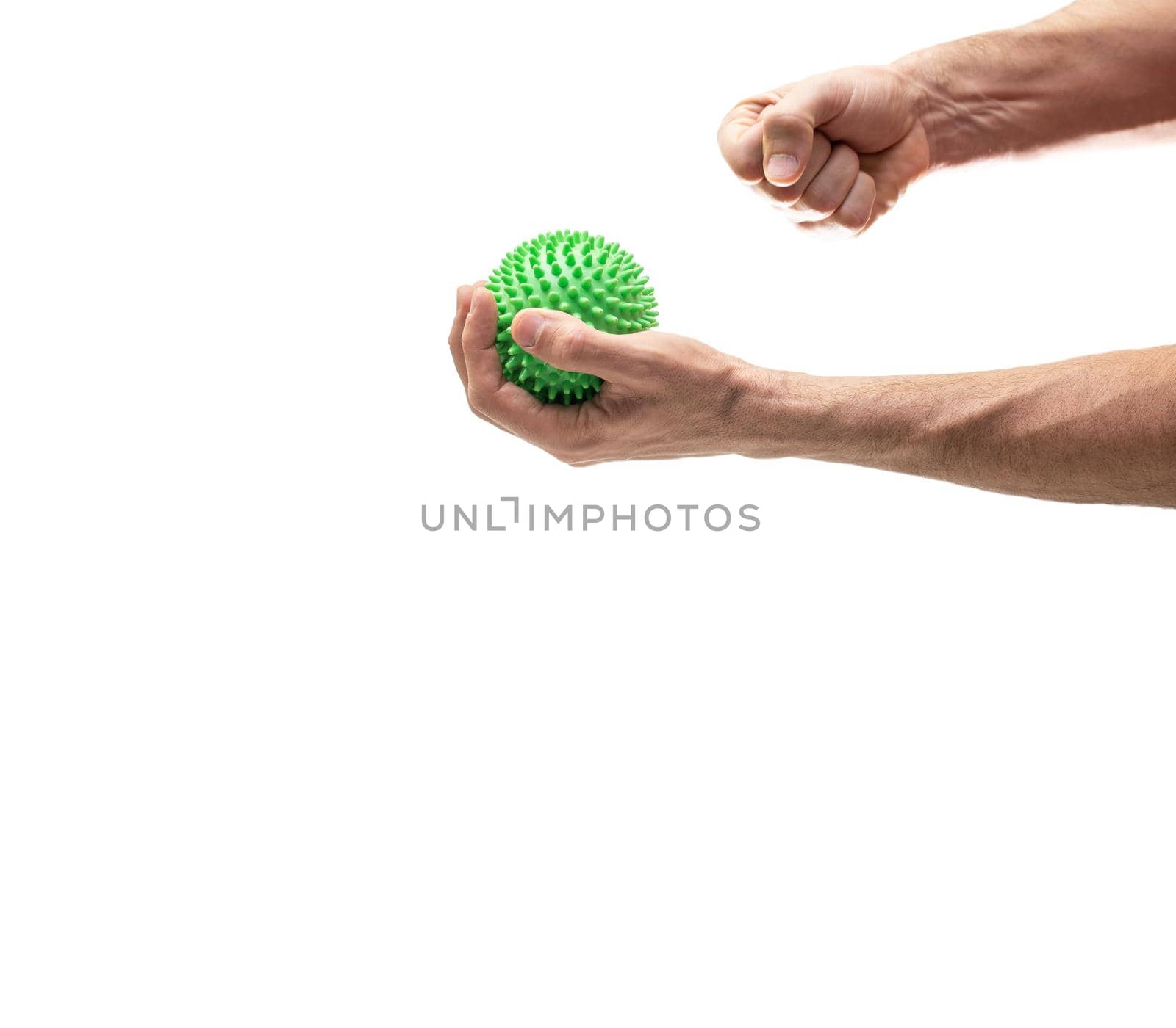 Hand holding sphere with spines while right fist crushes it against white by FerradalFCG