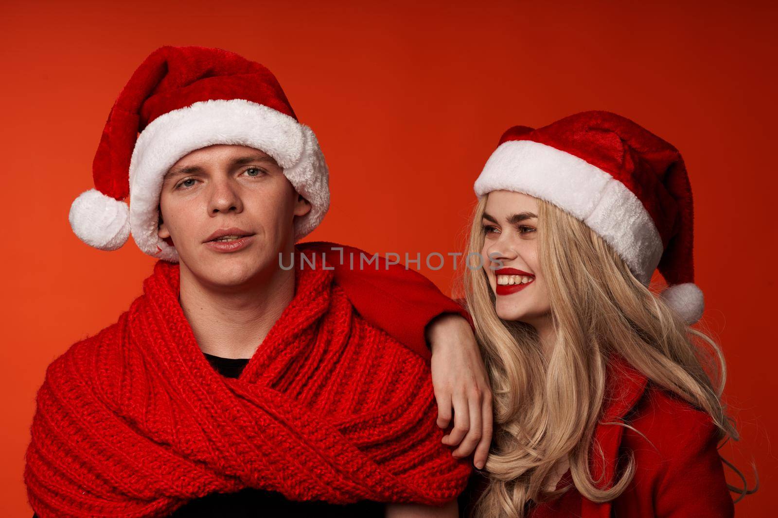 family in New Year's clothes Christmas holiday red background by SHOTPRIME