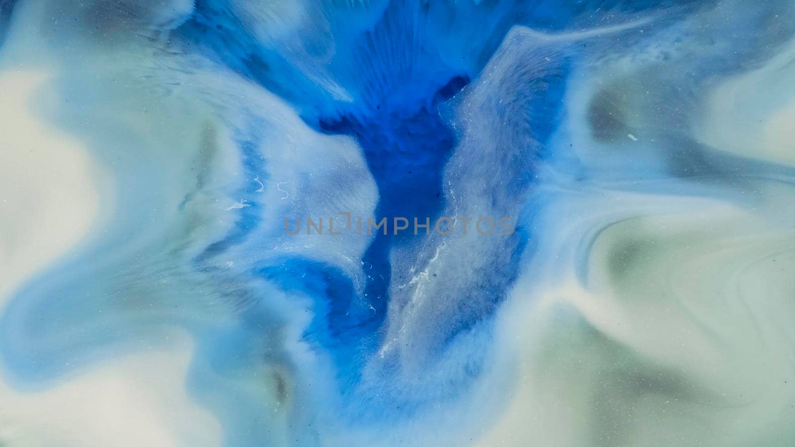 Fluid paint art, marble abstractions in blue, black and yellow. Deep ink blanks. Abstract unique colorful background. Artistic painting of natural spreading. Abstract textural art. Liquid forms of design. Ink transitions. Colorful cell background, splash screen, background.