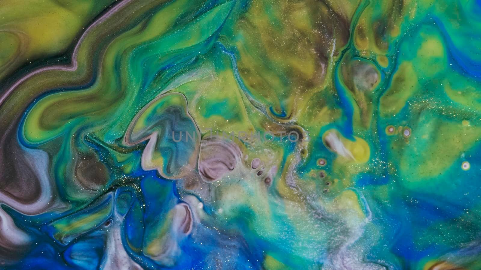 Fluid paint art, marble abstractions in blue, purple, black and yellow. Deep ink blanks. Abstract unique colorful background. Artistic painting of natural spreading. Abstract textural art. Liquid forms of design. Ink transitions. Colorful cell background, splash screen, background.