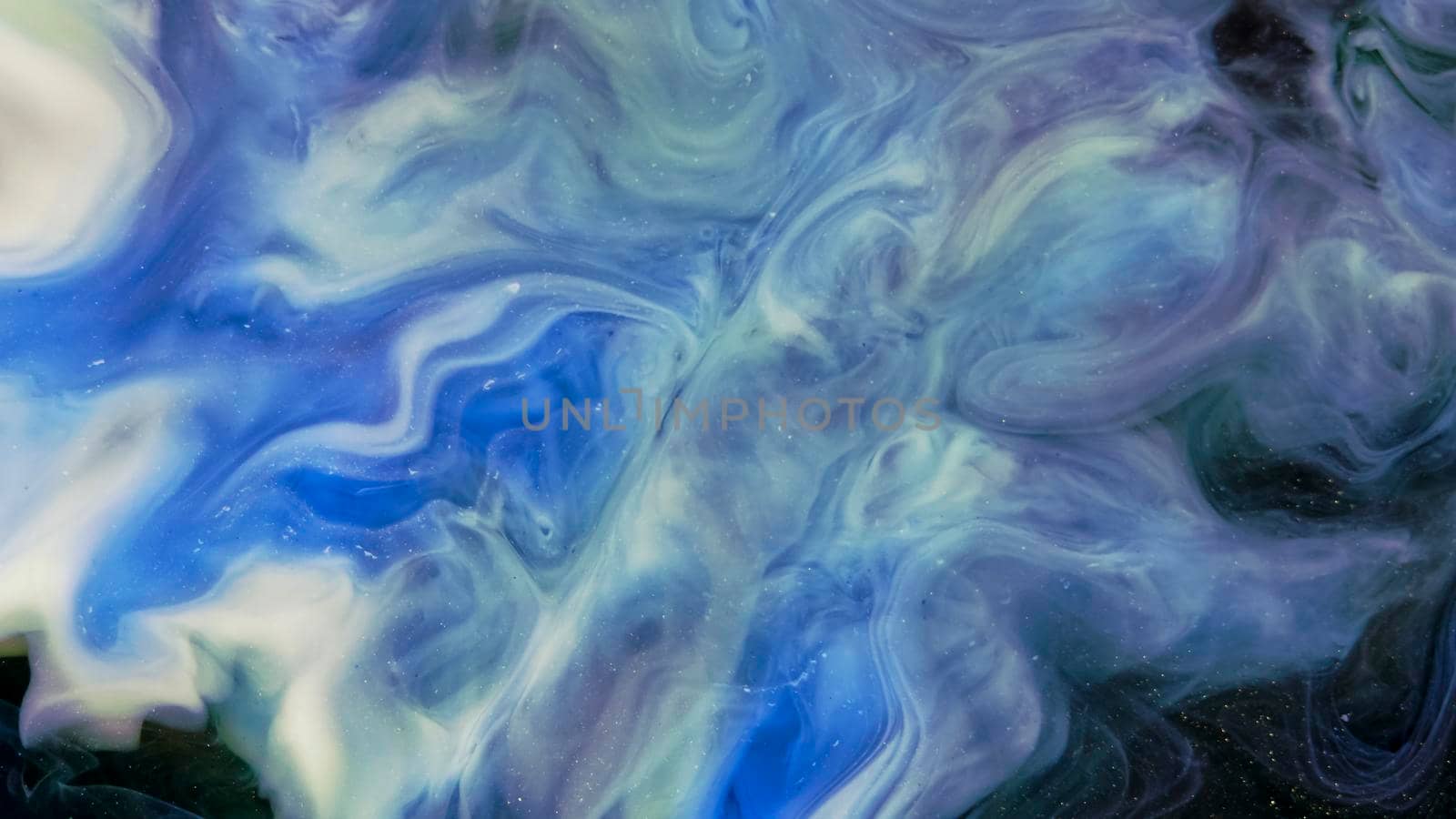 Fluid paint art, marble abstractions in blue, black and yellow. Deep ink blanks. Abstract unique colorful background. Artistic painting of natural spreading. Abstract textural art. Liquid forms of design. Ink transitions. Colorful cell background, splash screen, background.