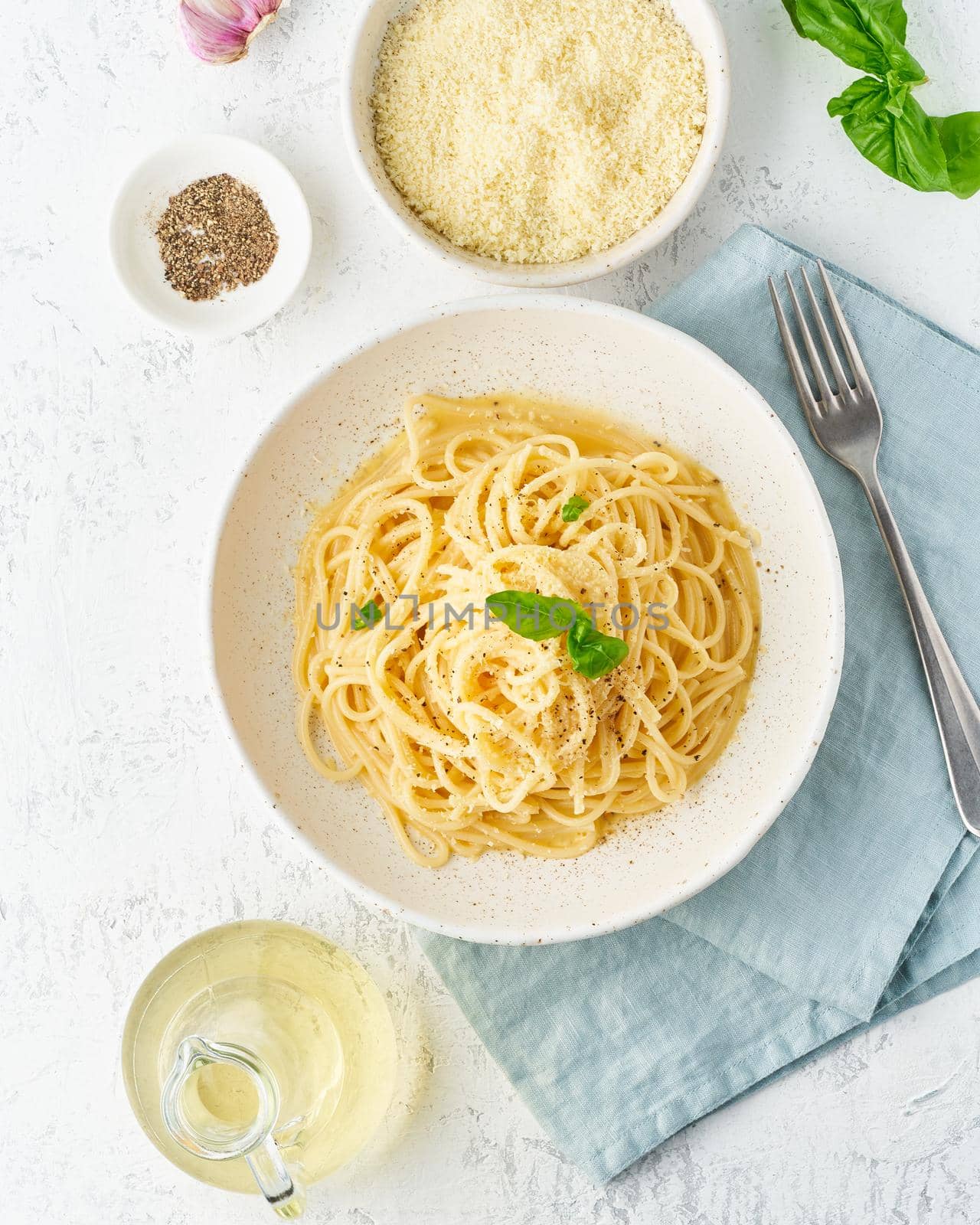 Cacio e pepe pasta. Spaghetti with parmesan cheese and pepper. by NataBene