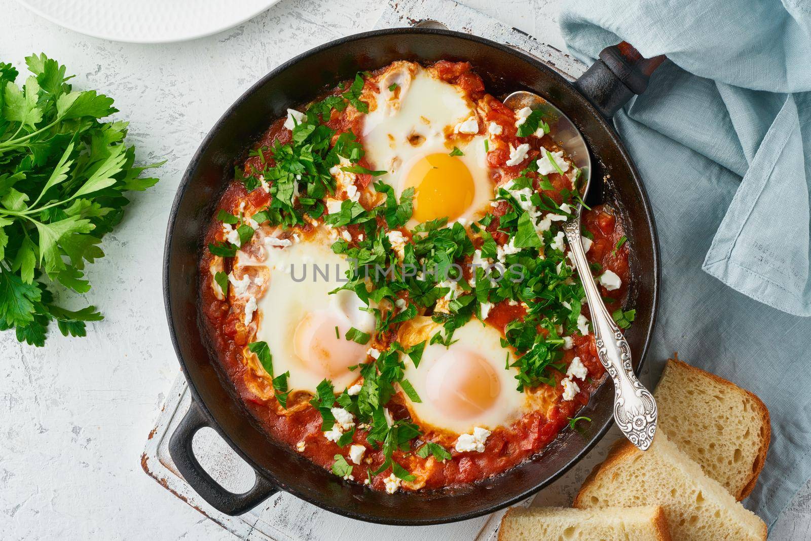 Shakshouka, eggs poached in sauce of tomatoes, olive oil, peppers, onion and garlic, Mediterranean cuisine. Keto meal, FODMAP recipe, low carb