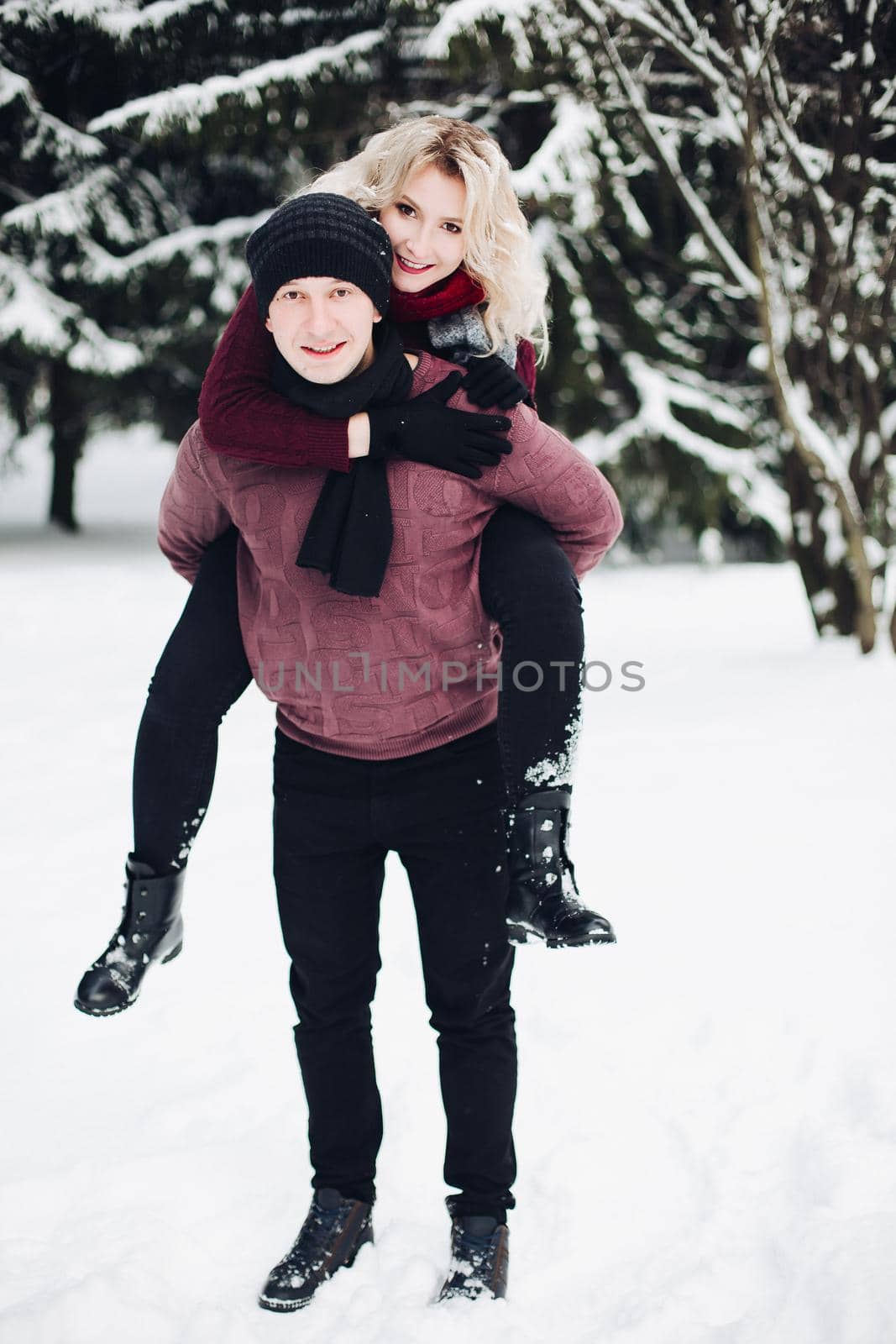 Happy couple in winter forest. by StudioLucky