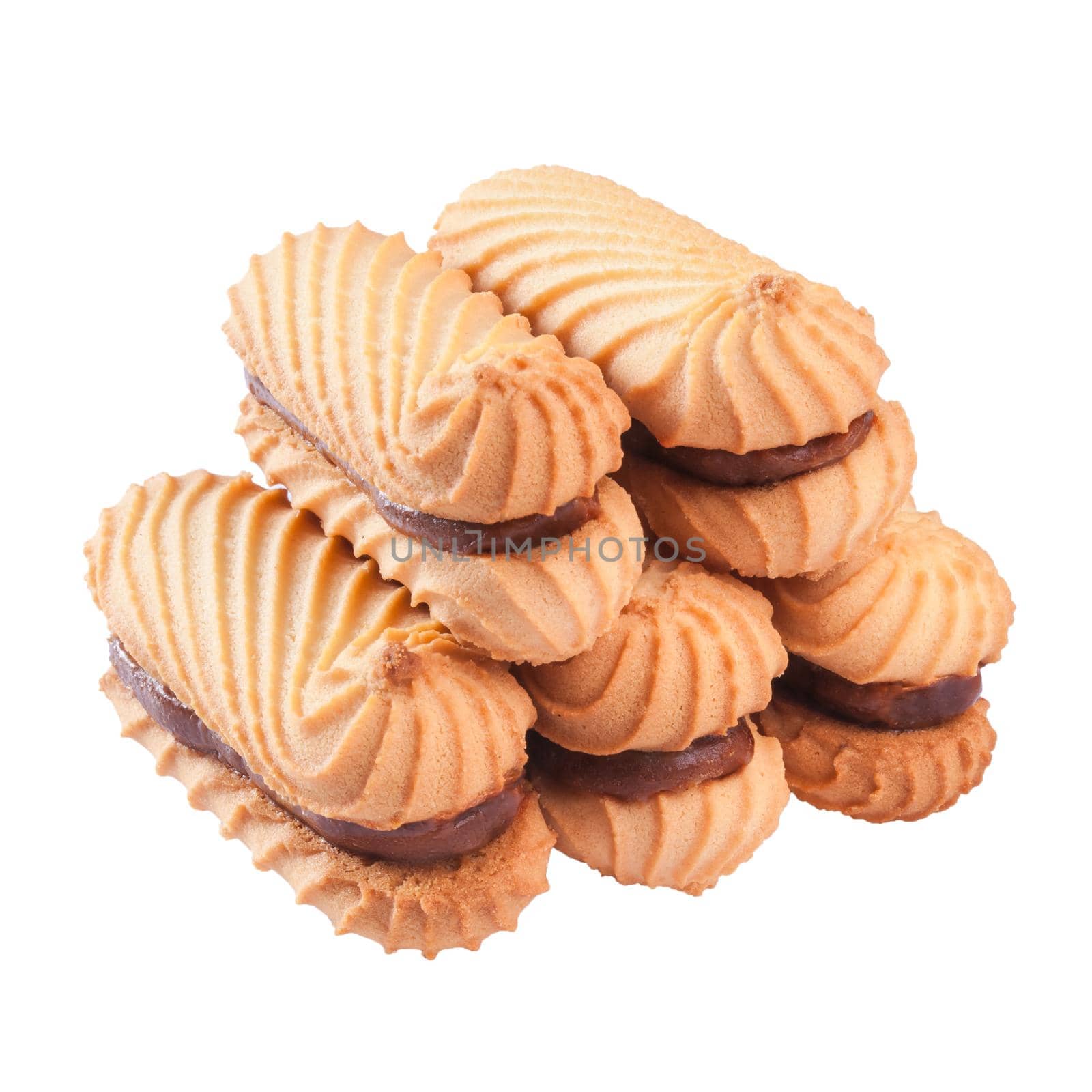 Stack of appetizing crunchy shortbread sandwich cookies stuffed with boiled condensed milk isolated on white background
