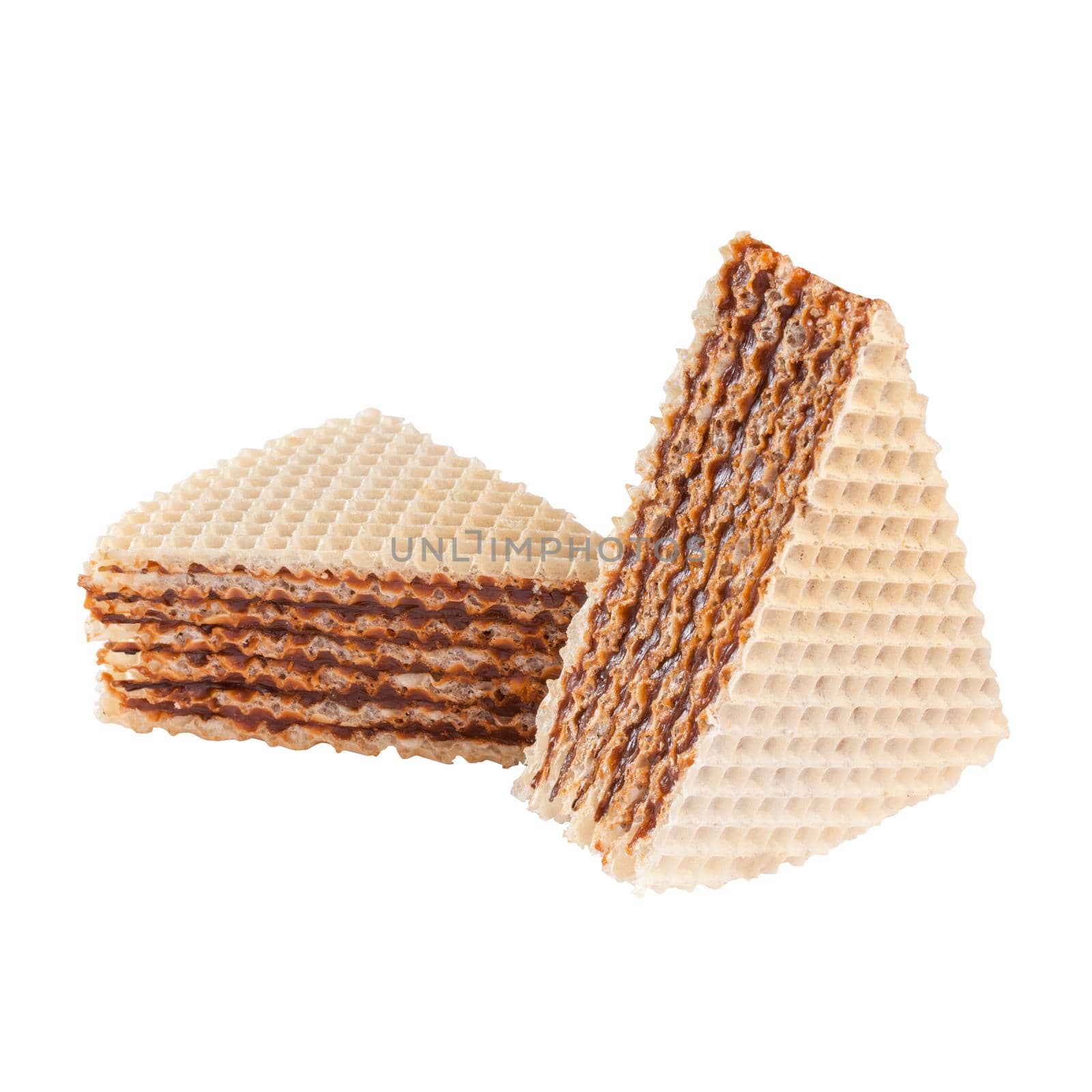 Two slices of traditional ukrainian waffle cake with cooked sweetened condensed milk isolated on white background. Popular sweets