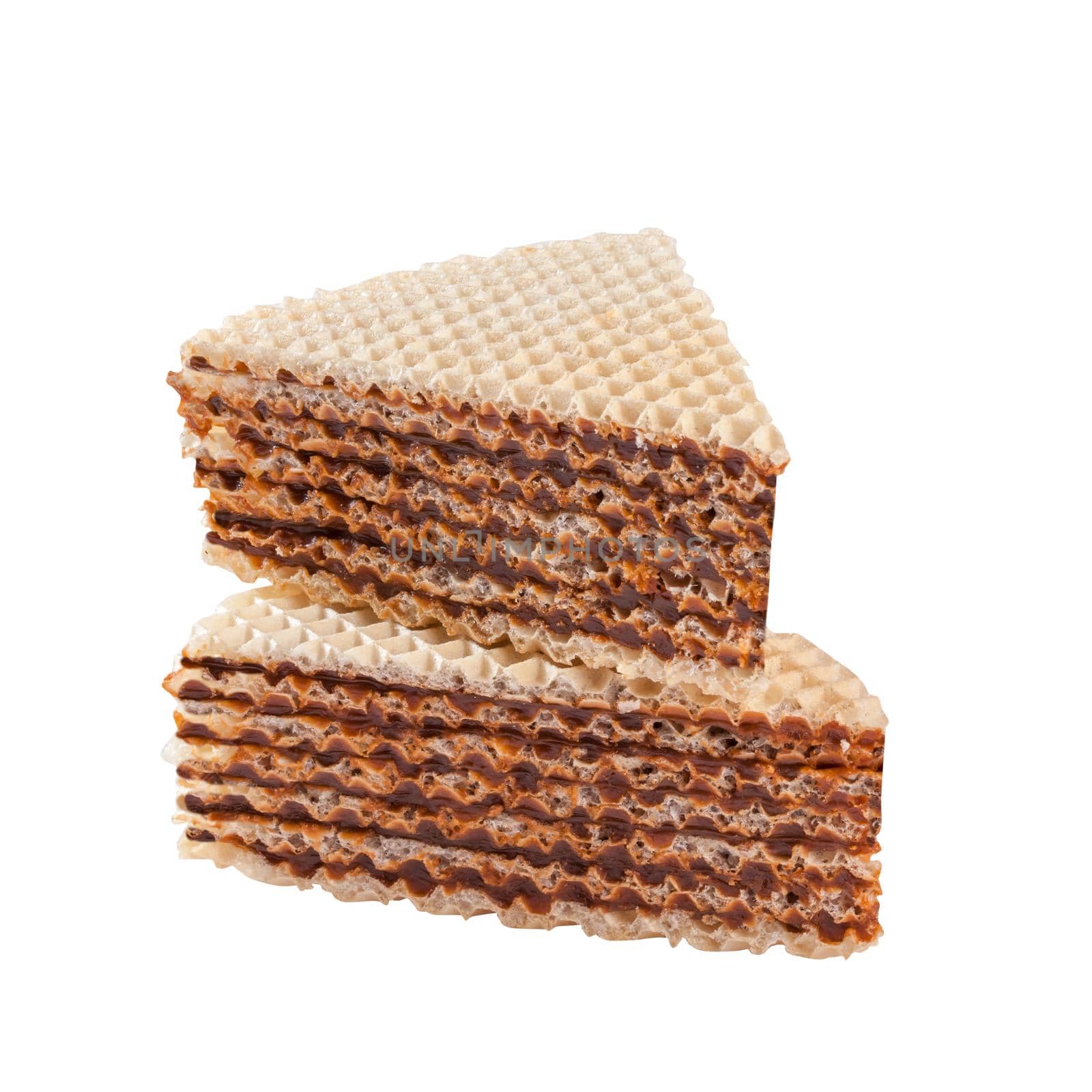 Slices of delicious no-bake waffle cake filled with caramelized milk dulce de leche isolated on white background