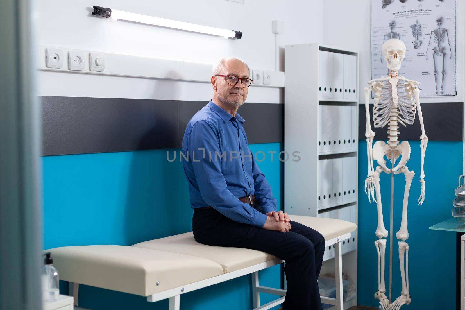 Retired senior old man standing on bed waiting for medication treatment ...