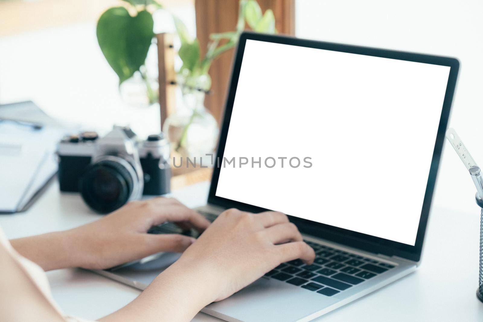 Cropping hands using computer laptop. Blank screen computer laptop for graphic display montage.