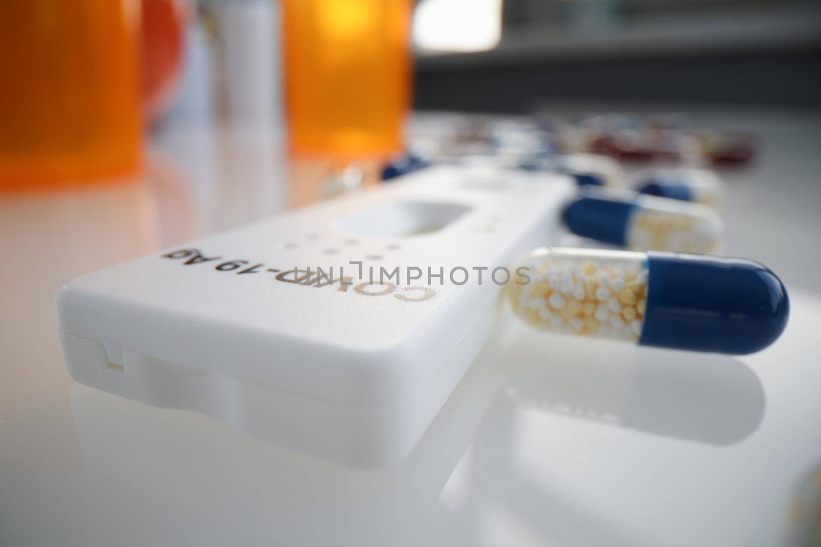 Express test for covid 19 antigen lying among many medical capsules closeup by kuprevich