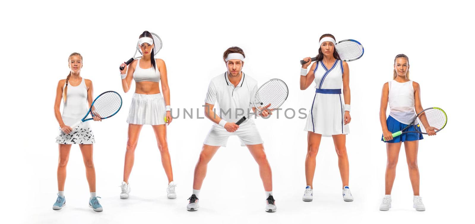 Four tennis players with racket in white costume. Women athlete playing isolated on white background. by MikeOrlov