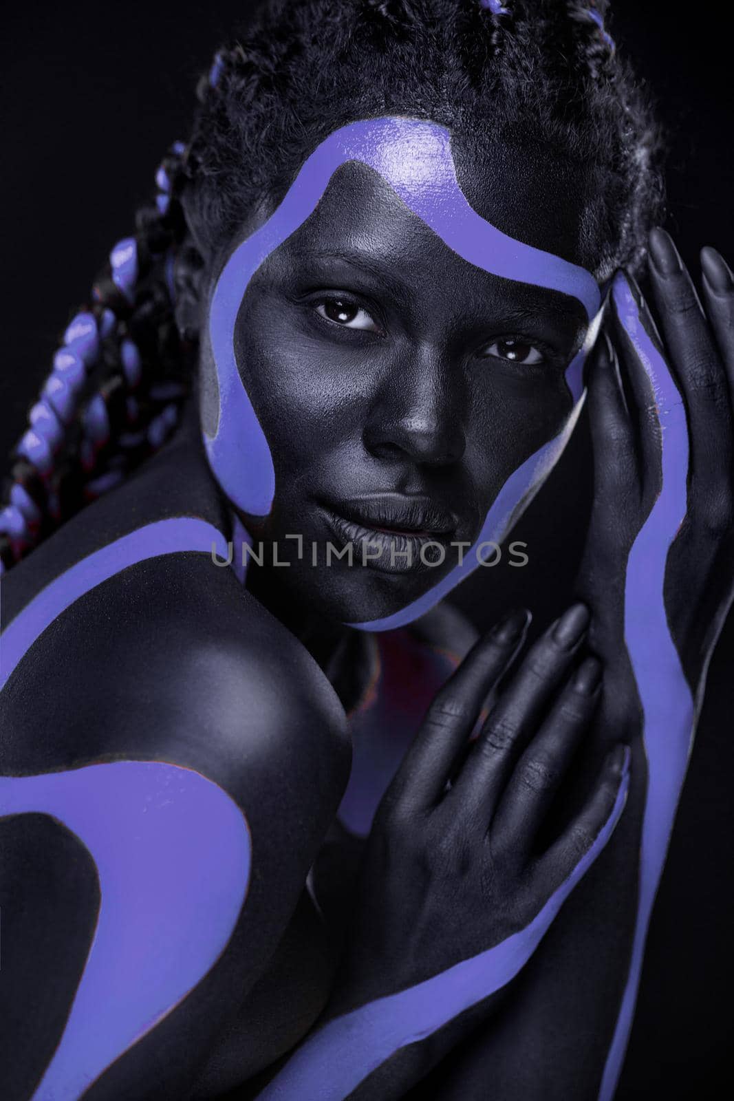 Neon concept. Purple and black body paint. Woman with face art. Young girl with bodypaint. An amazing model with makeup. Check Case number 10990522