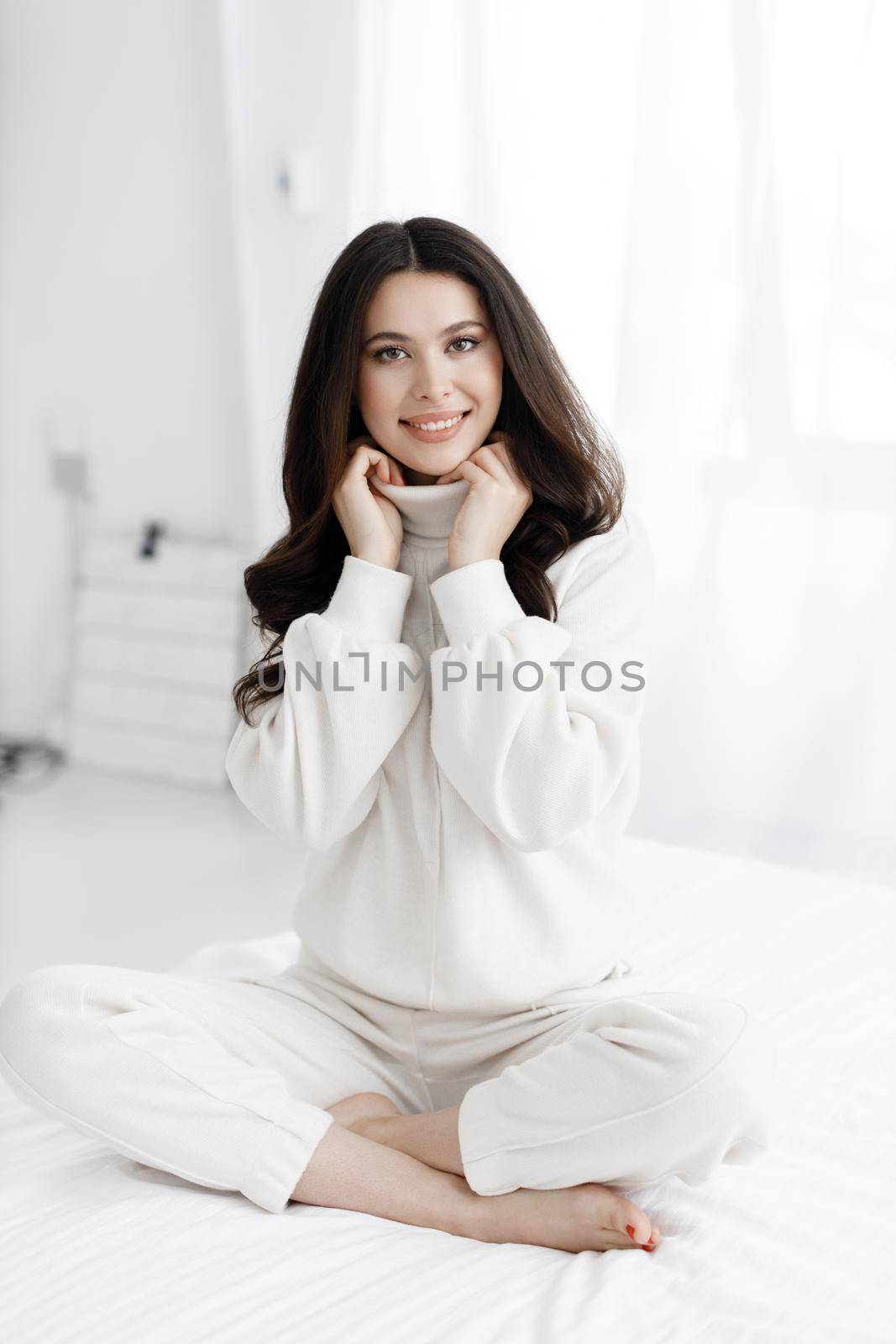 Young happy woman portrait indoor at by splash
