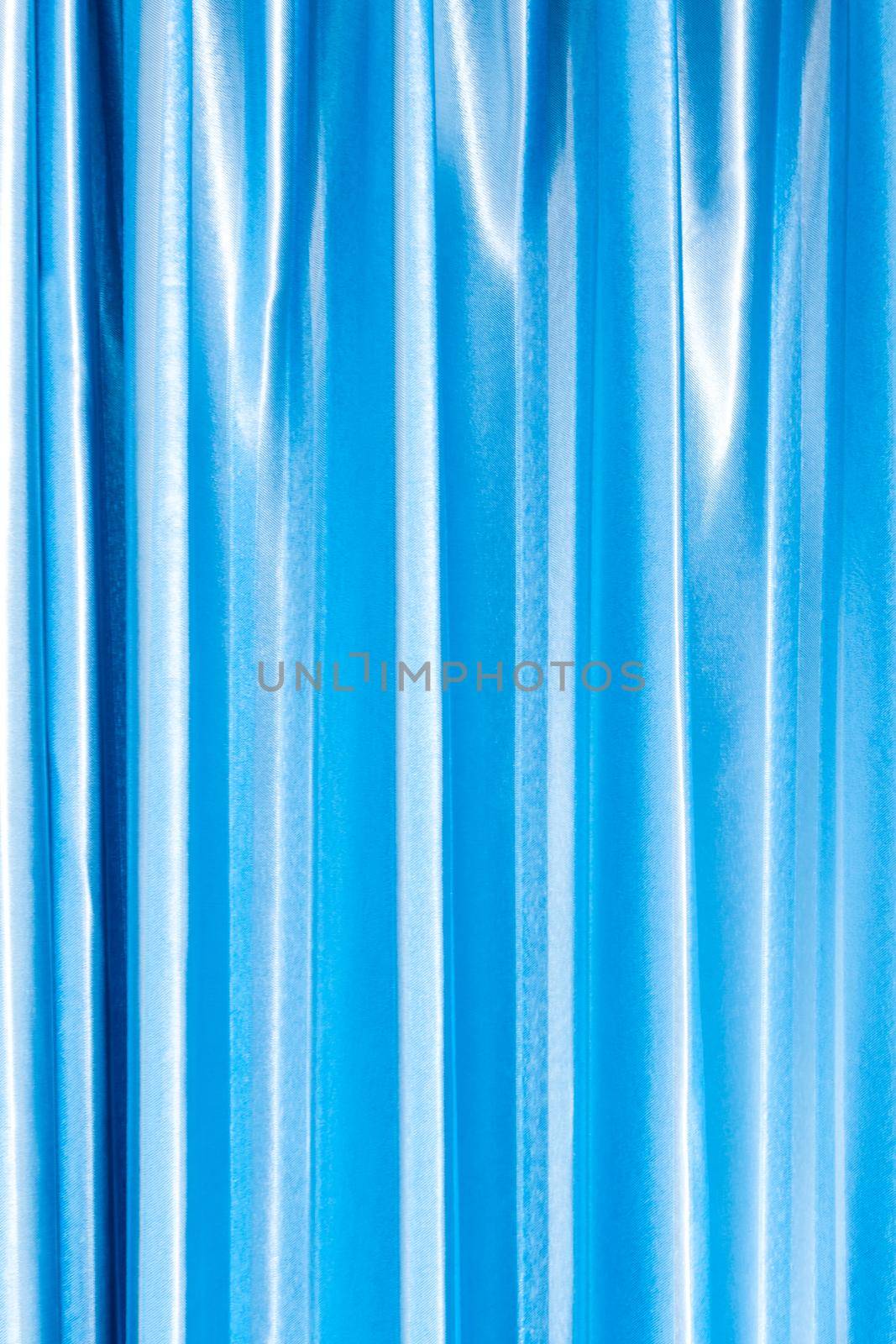 Bright and shiny blue color of curtain by Satakorn