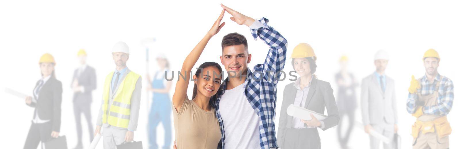 Couple making roof with hands symbol of new home and team of construction workers. Isolated on white background