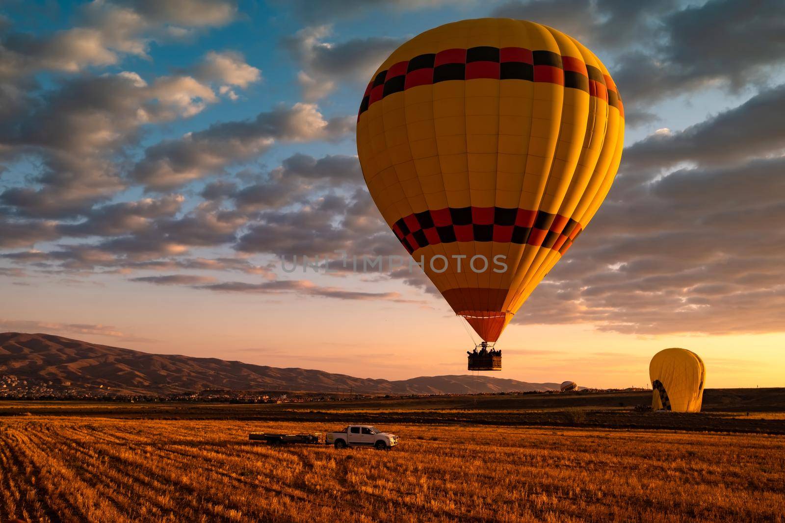 Hot air balloon festival ending at sunset in Cappadocia, Turkey