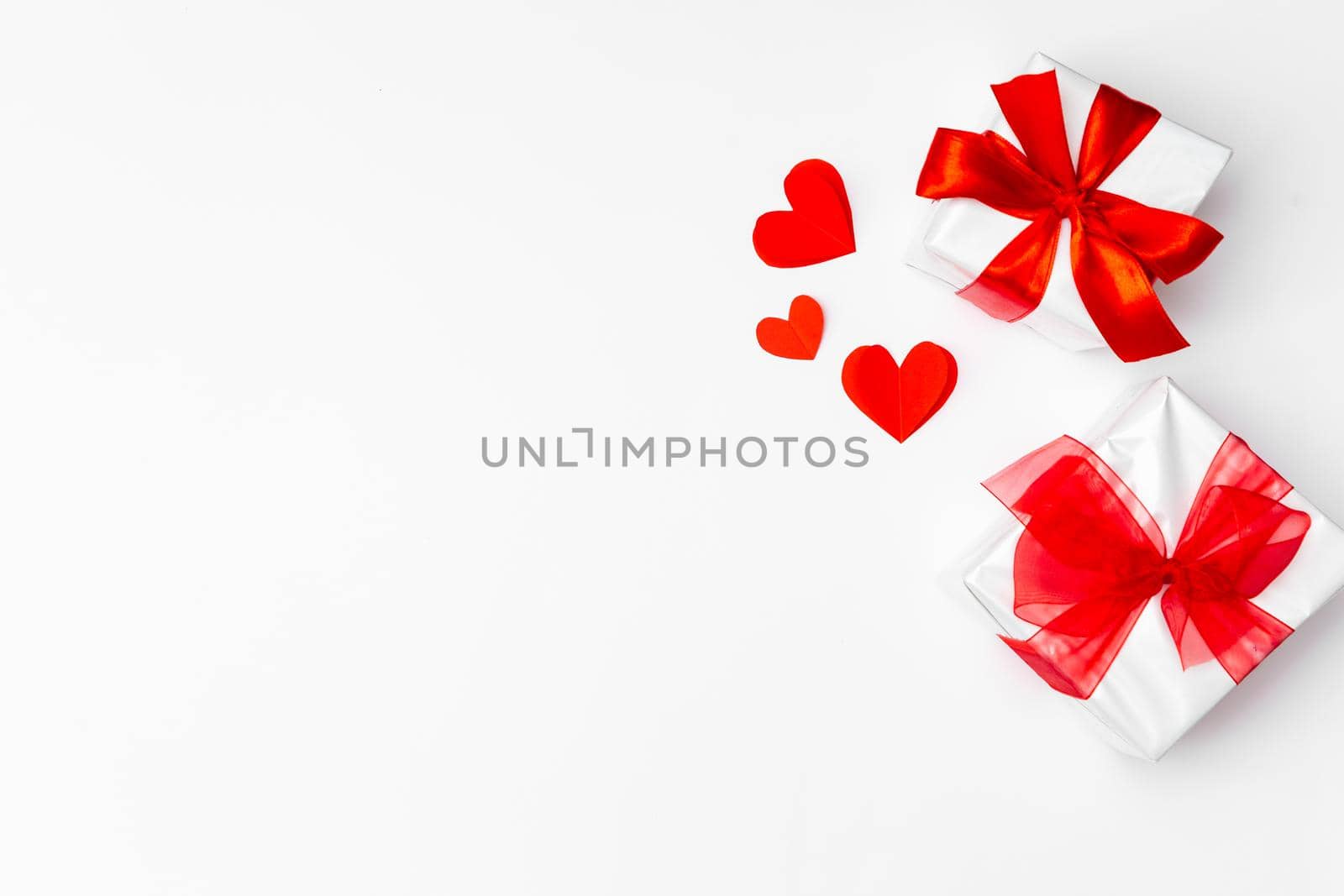 Valentine's Day background. Gifts, hears on white. Concept of love, affection. Holiday card.