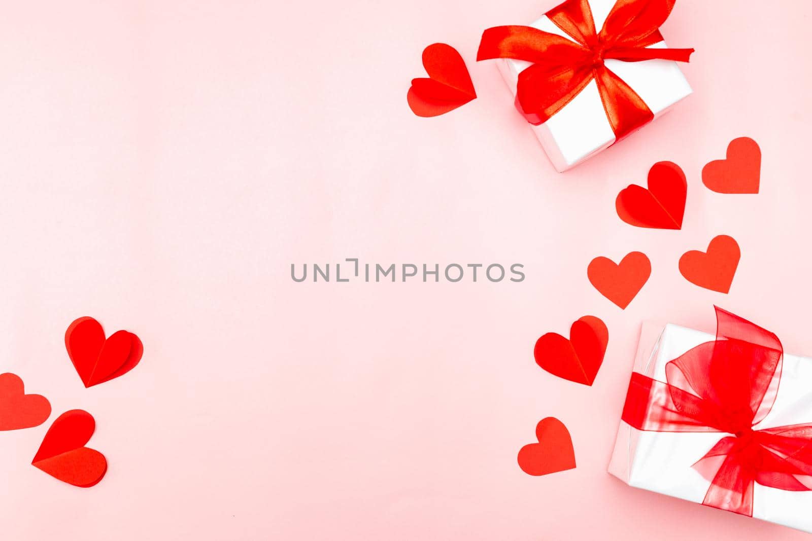 Valentine's Day. Gifts, hearts on rose background. Concept of love, affection. Holiday card.