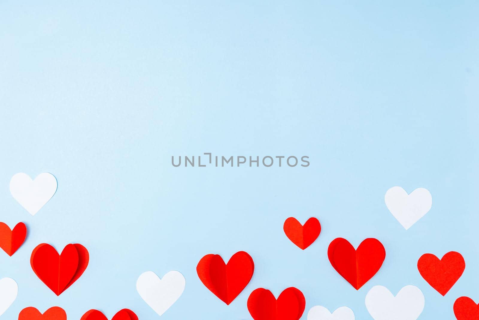 Valentine's Day. Gifts, hearts on blue background. Concept of love and affection. Holiday card. by Marina-A