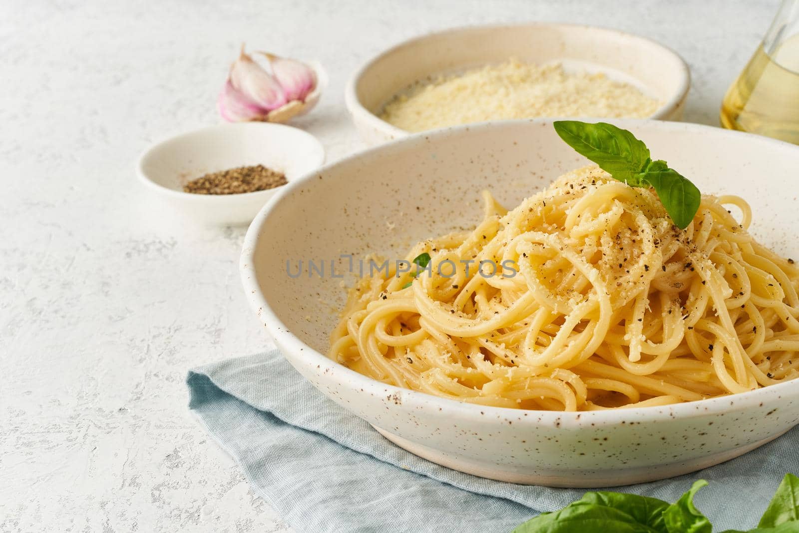 Cacio e pepe pasta. Spaghetti with parmesan cheese and pepper. by NataBene