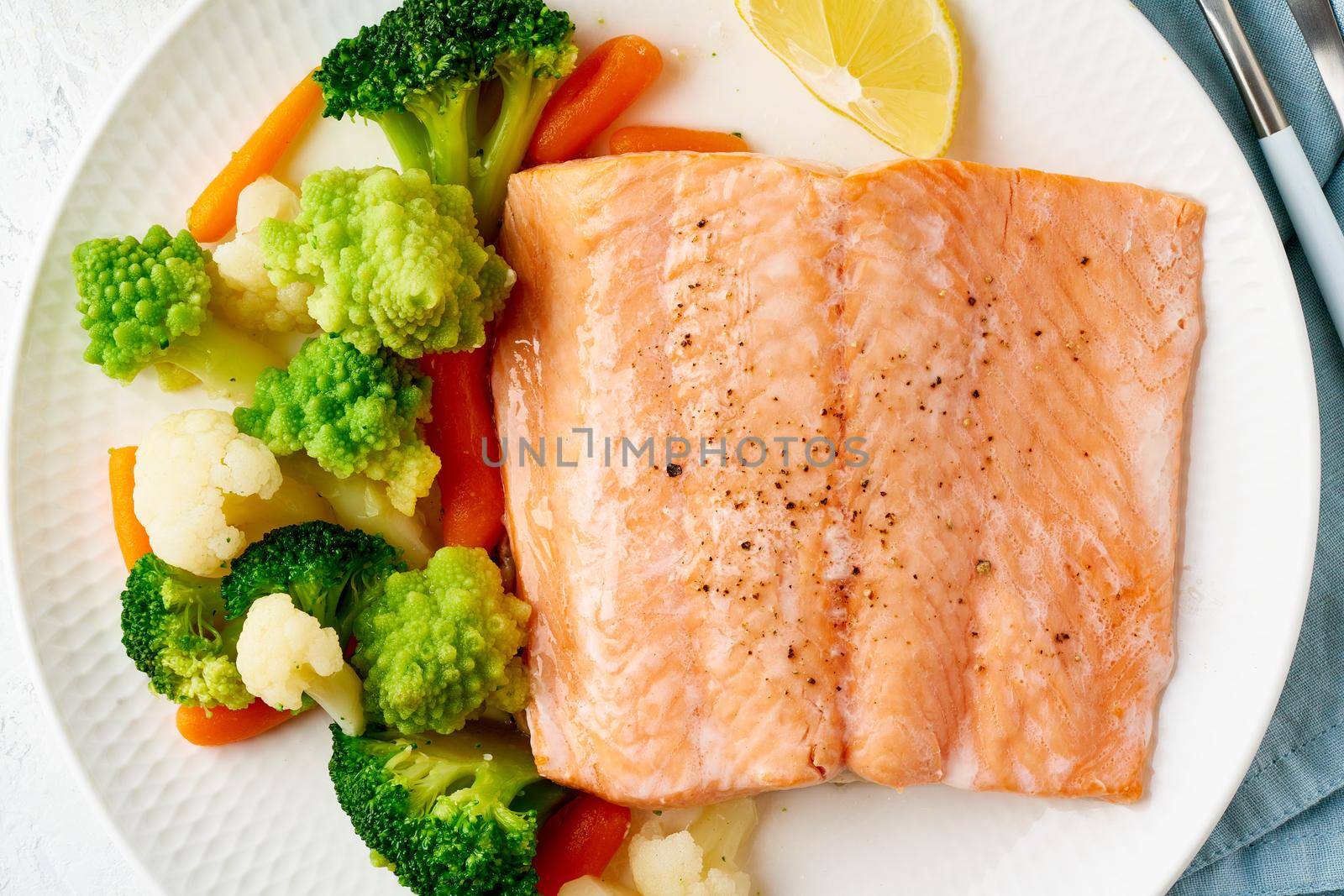 Macro steamed salmon and vegetables, Paleo, keto, fodmap, dash diet. Mediterranean diet with steam fish. Healthy concept, white plate on gray table, gluten free, lectine free, top view