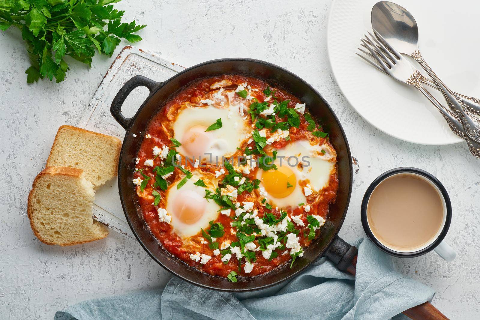 Shakshouka, eggs poached in sauce of tomatoes, olive oil, peppers, onion and garlic, Mediterranean cousine. Keto meal, FODMAP recipe, low carb