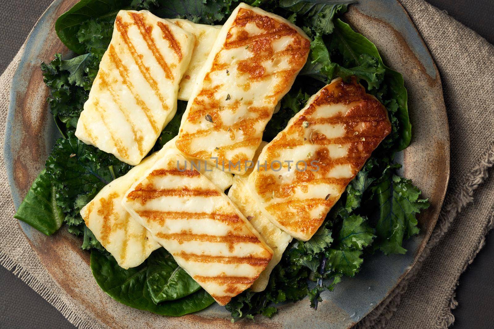 Keto, ketogenic diet. Cyprus fried halloumi cheese with healthy green salad. Lchf, pegan, fodmap, paleo, scd. Balanced food, a greek clean eating recipe, close up