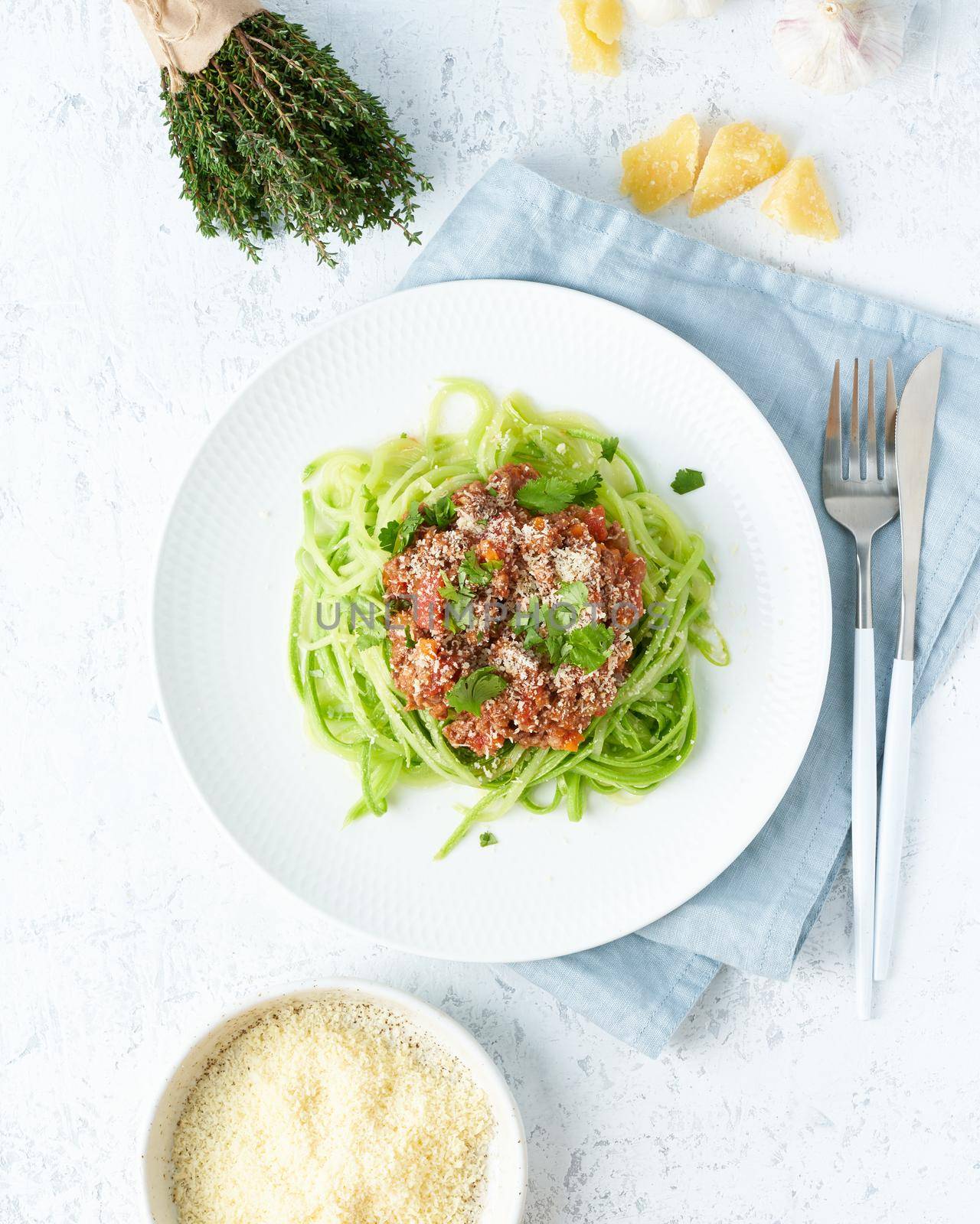 Keto pasta Bolognese with mincemeat and zucchini noodles. Top view, close up, vertical. by NataBene