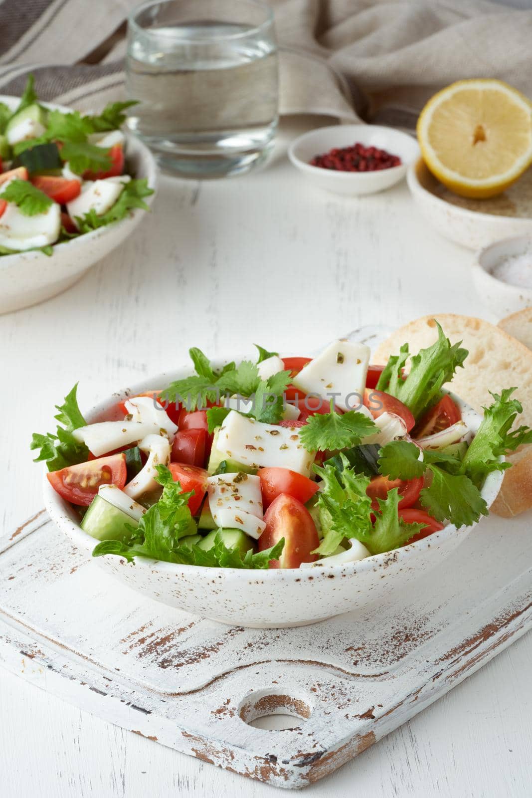 Seafood salad with squid, shrimp, cucumbers, tomatoes and lettuce. LCHF, FODMAP by NataBene