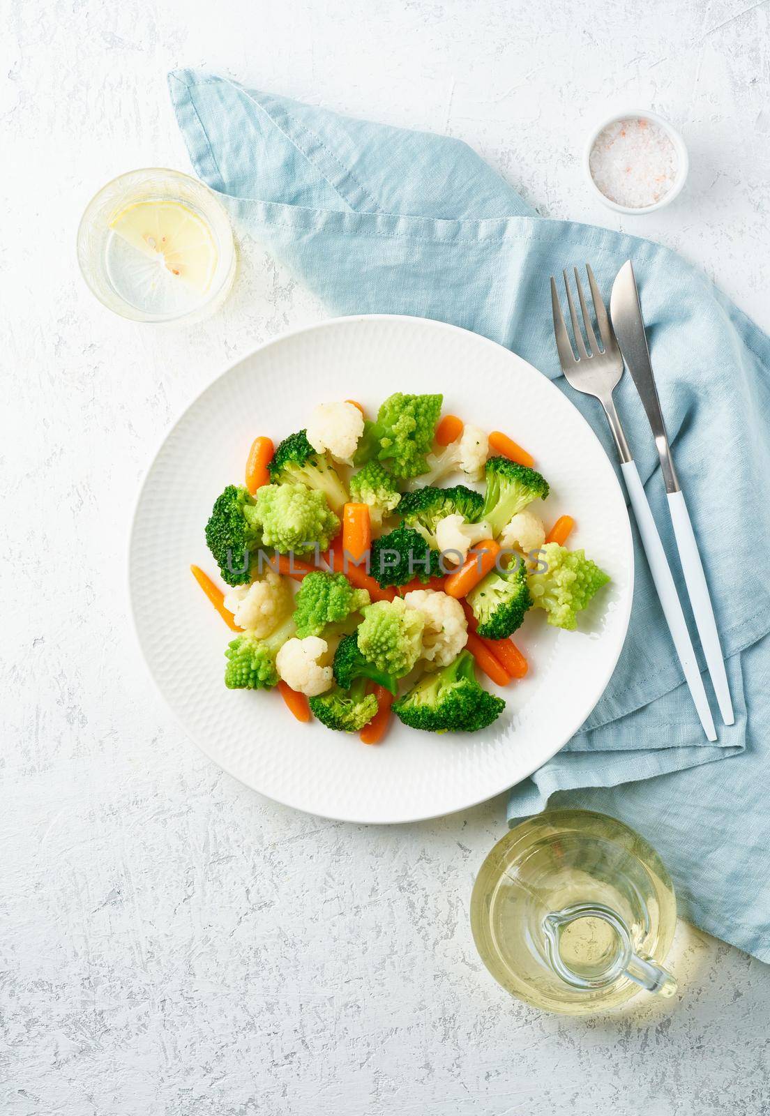 Mix of boiled vegetables. Broccoli, carrots, cauliflower. Steamed vegetables for dietary low-calorie diet. FODMAP, dash diet, vegan, vegetarian, top view