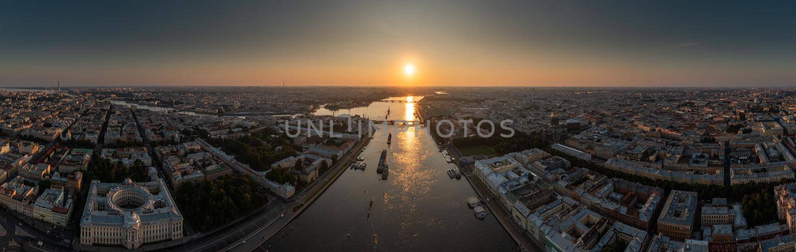 Aerial panoramic landscape of warships in the waters of the Neva River before the holiday of the Russian Navy, sea power, the latest cruisers among the sights, Isaac cathedral on a background. High quality photo