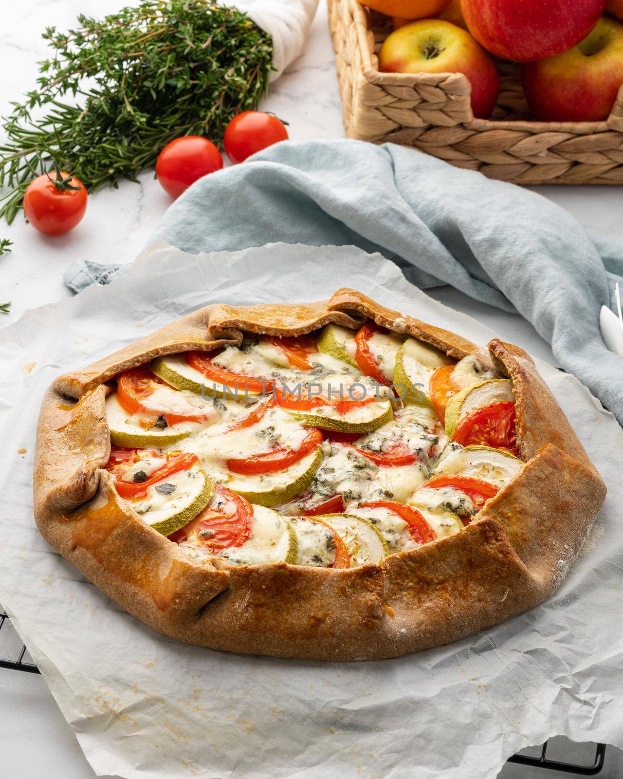 Homemade savory galette with vegetables, wholegrain pie with tomatoes, zucchini, blue cheese by NataBene