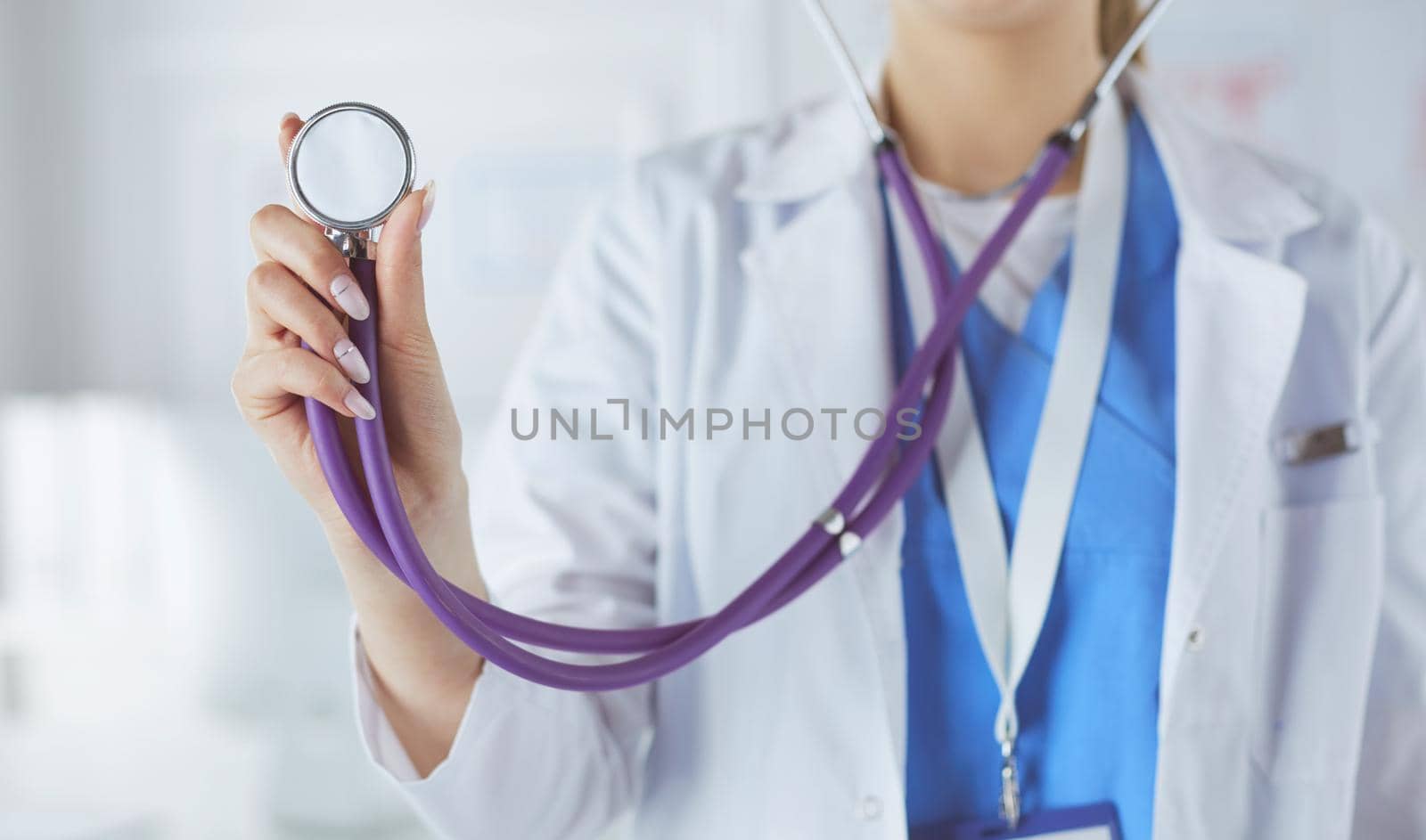 Smiling medical doctor woman with stethoscope in hospital.