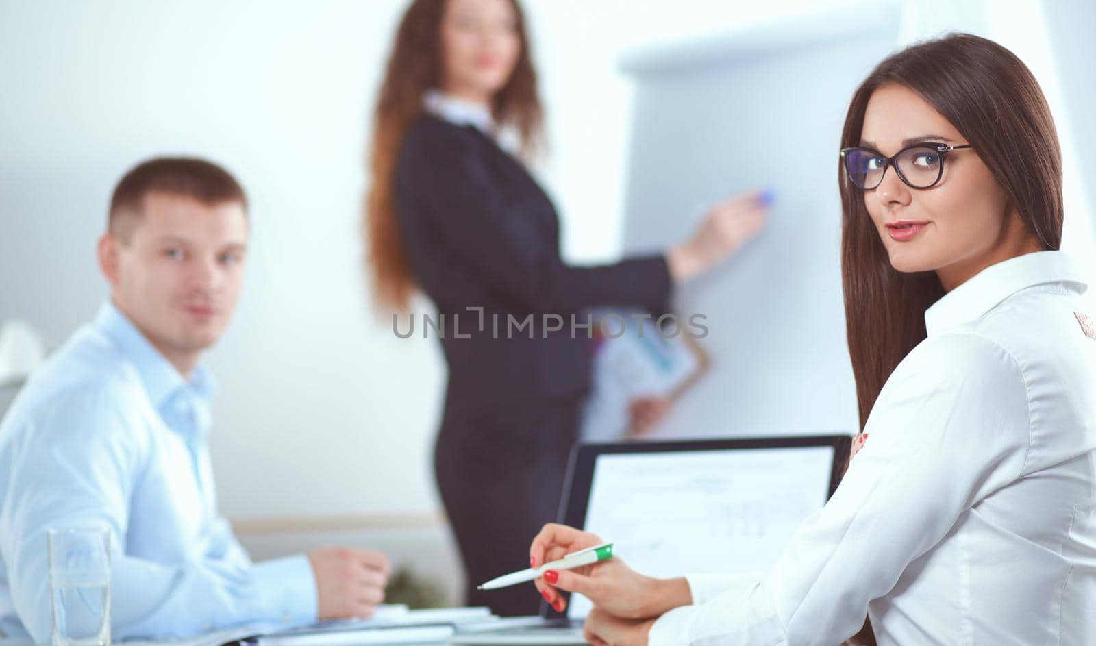 Business people sitting and discussing at business meeting