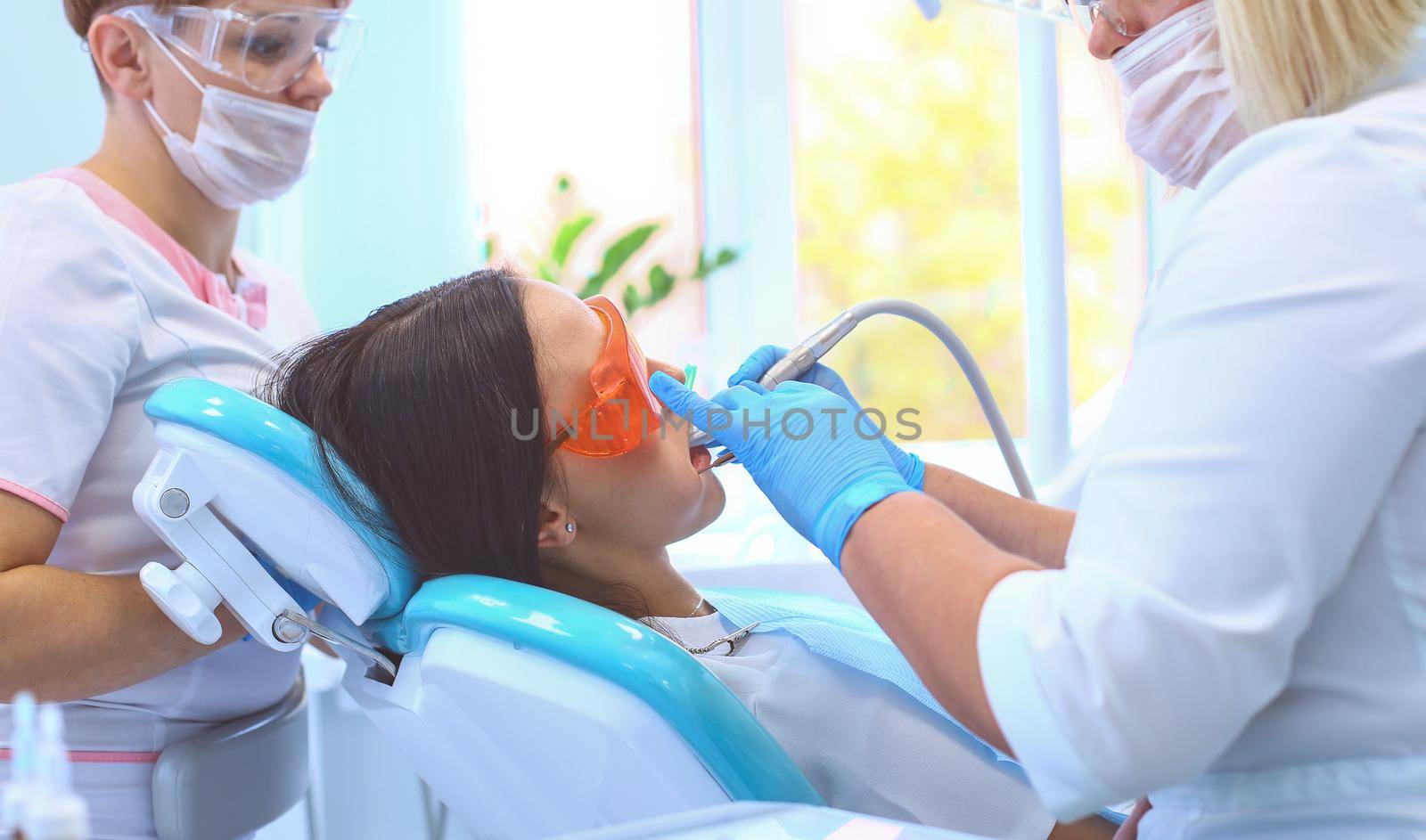 Healthy teeth patient at dentist office dental caries prevention by lenets