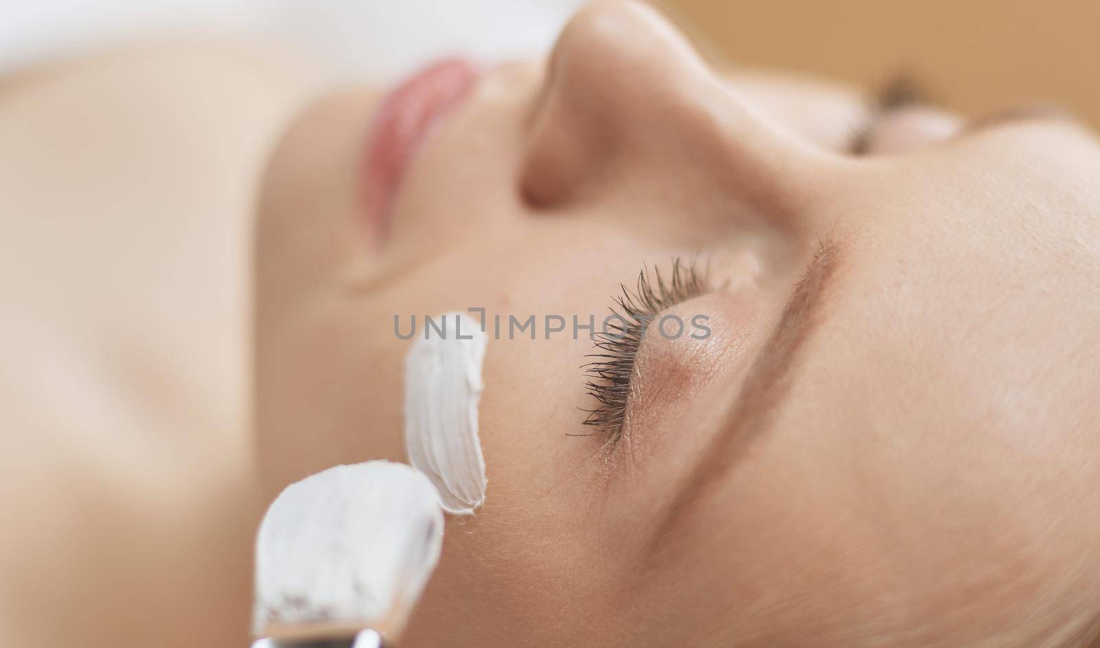 Spa facial mask application. Spa beauty organic facial mask application at day spa salon.