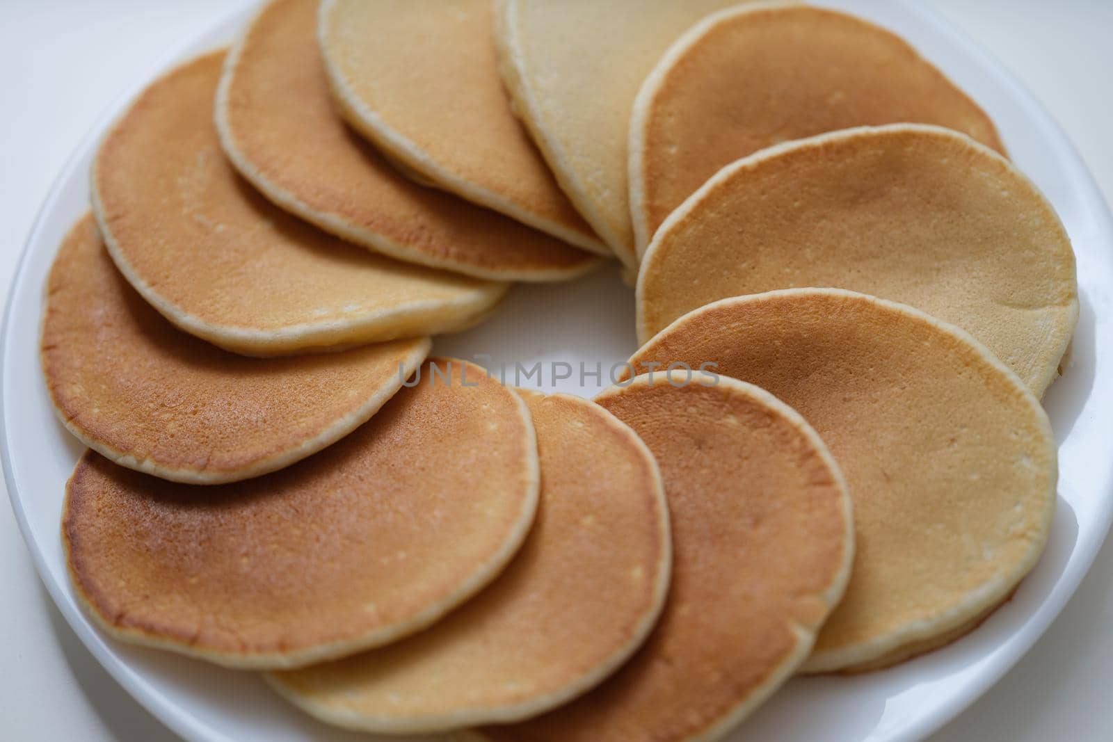 Plate with fresh tasty homemade pancake, hot delicious meal for breakfast by kuprevich