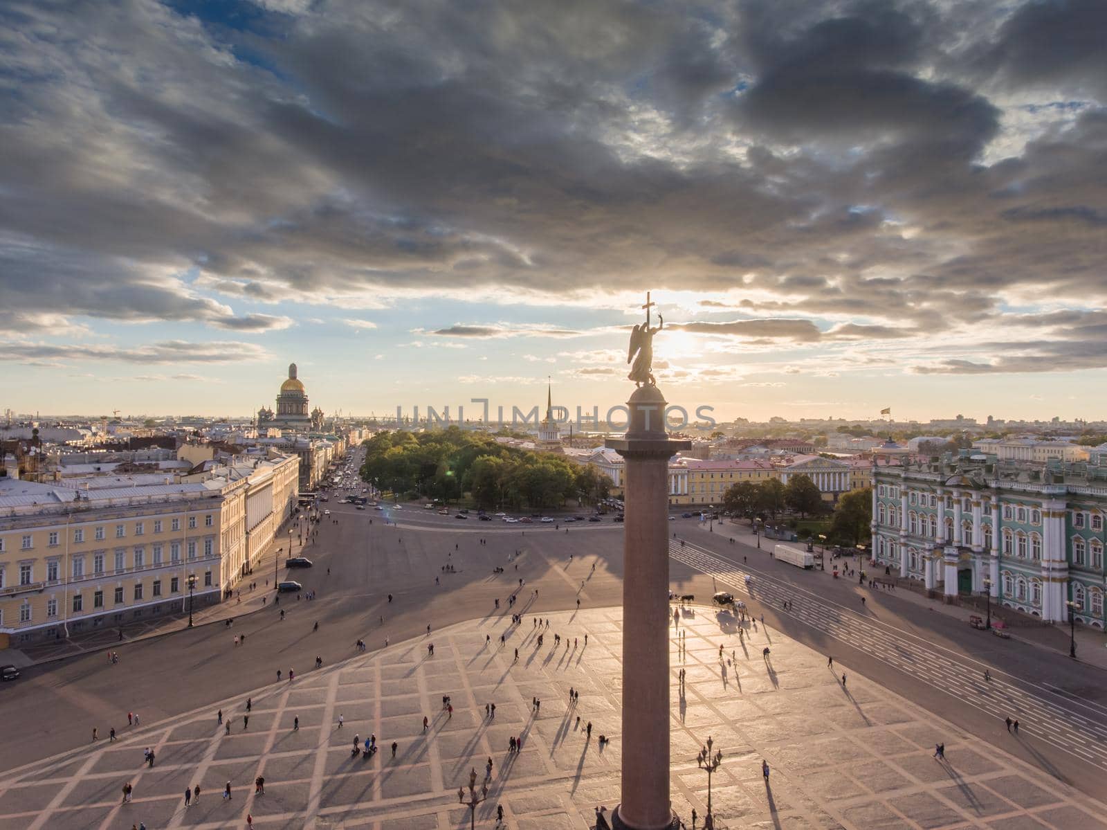 erial view of Palace Square and Alexandr Column at sunset, a gold dome of St. Isaac's Cathedral, golden spire of Admiralty building, the Winter Palace, long shadows, cloud. High quality photo