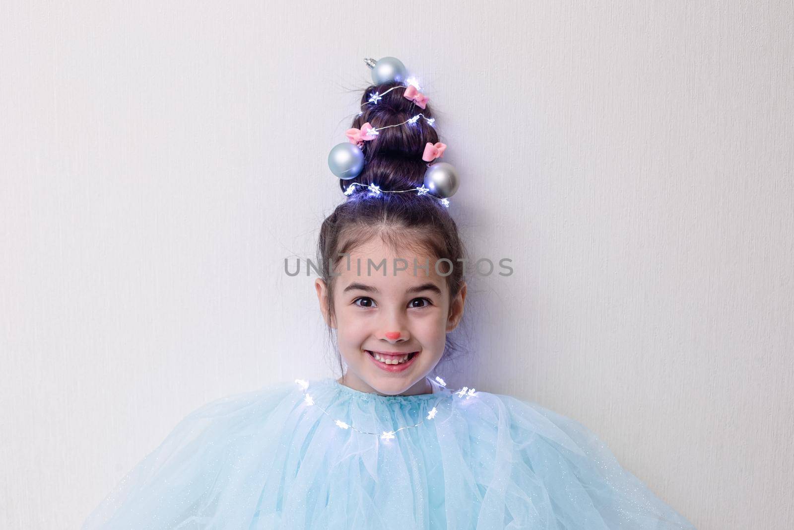 Portrait of funny girl with a hairstyle in the form of a Christmas tree by Zakharova