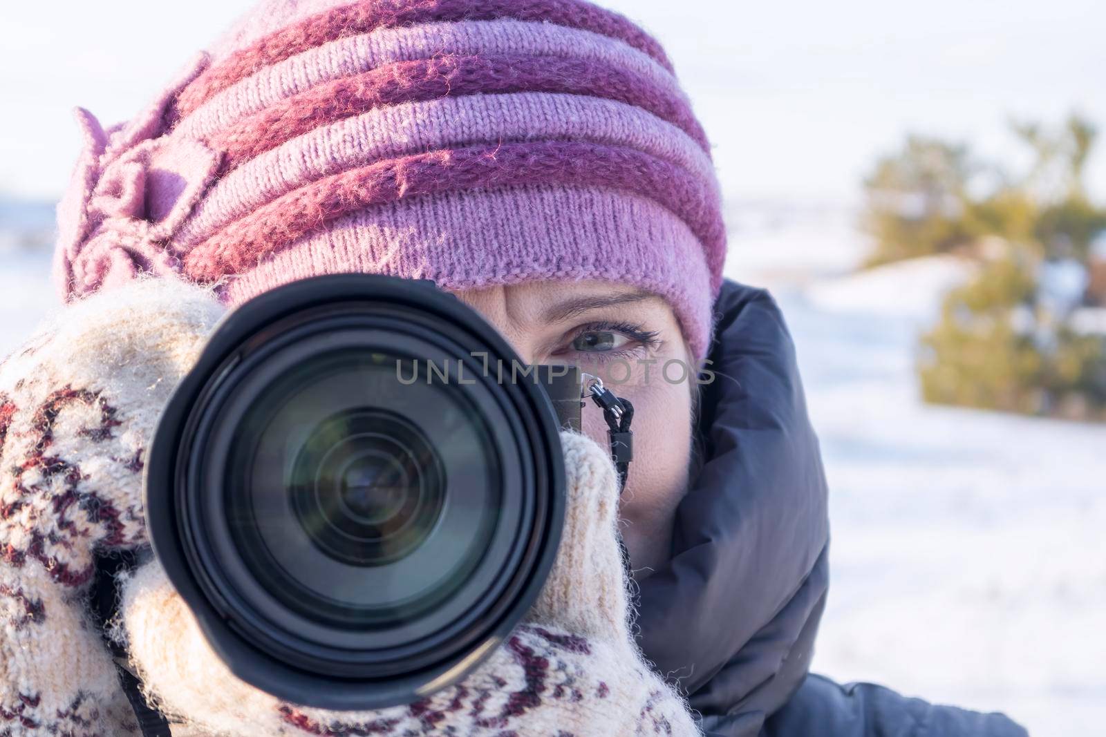 portrait of a photographer with a camera on his face. High quality photo