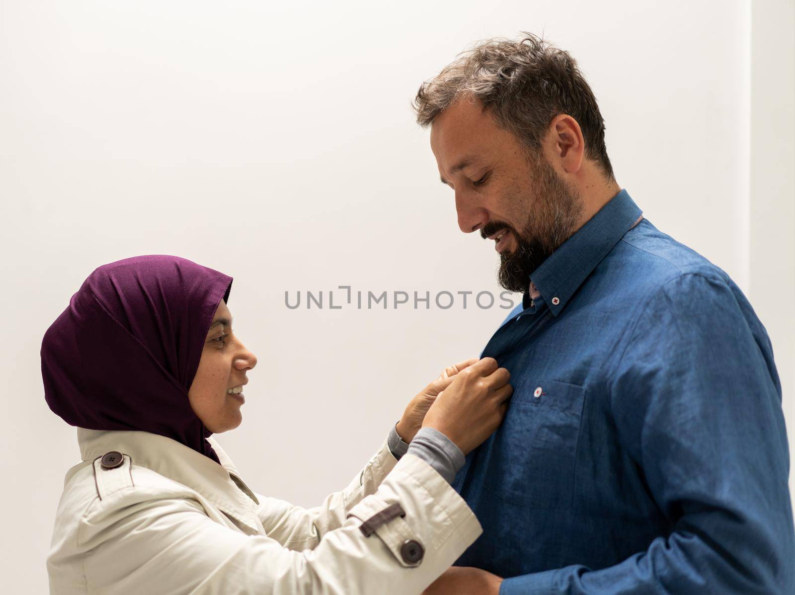 People, Woman helping man and adjusting tie on his neck with soft focus, care and clothing concept. High quality photo