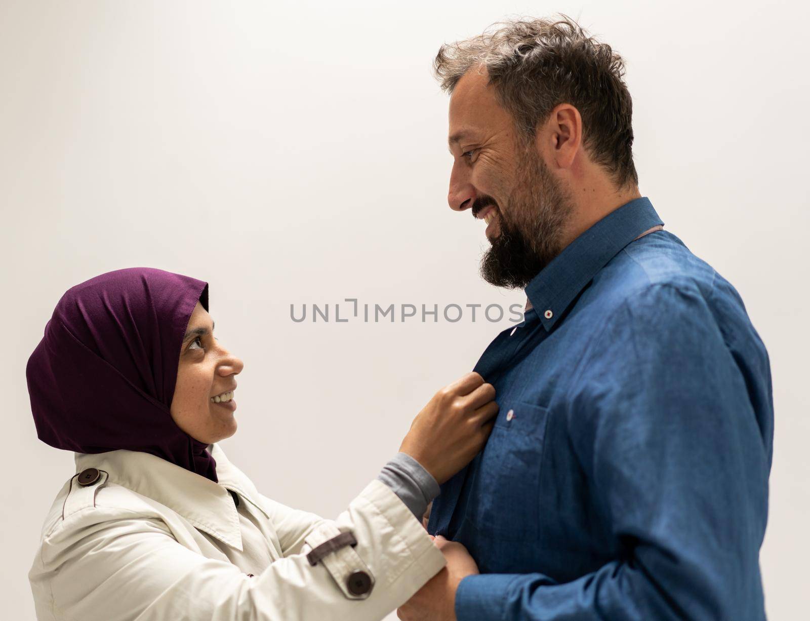 People, Woman helping man and adjusting tie on his neck with soft focus, care and clothing concept. High quality photo