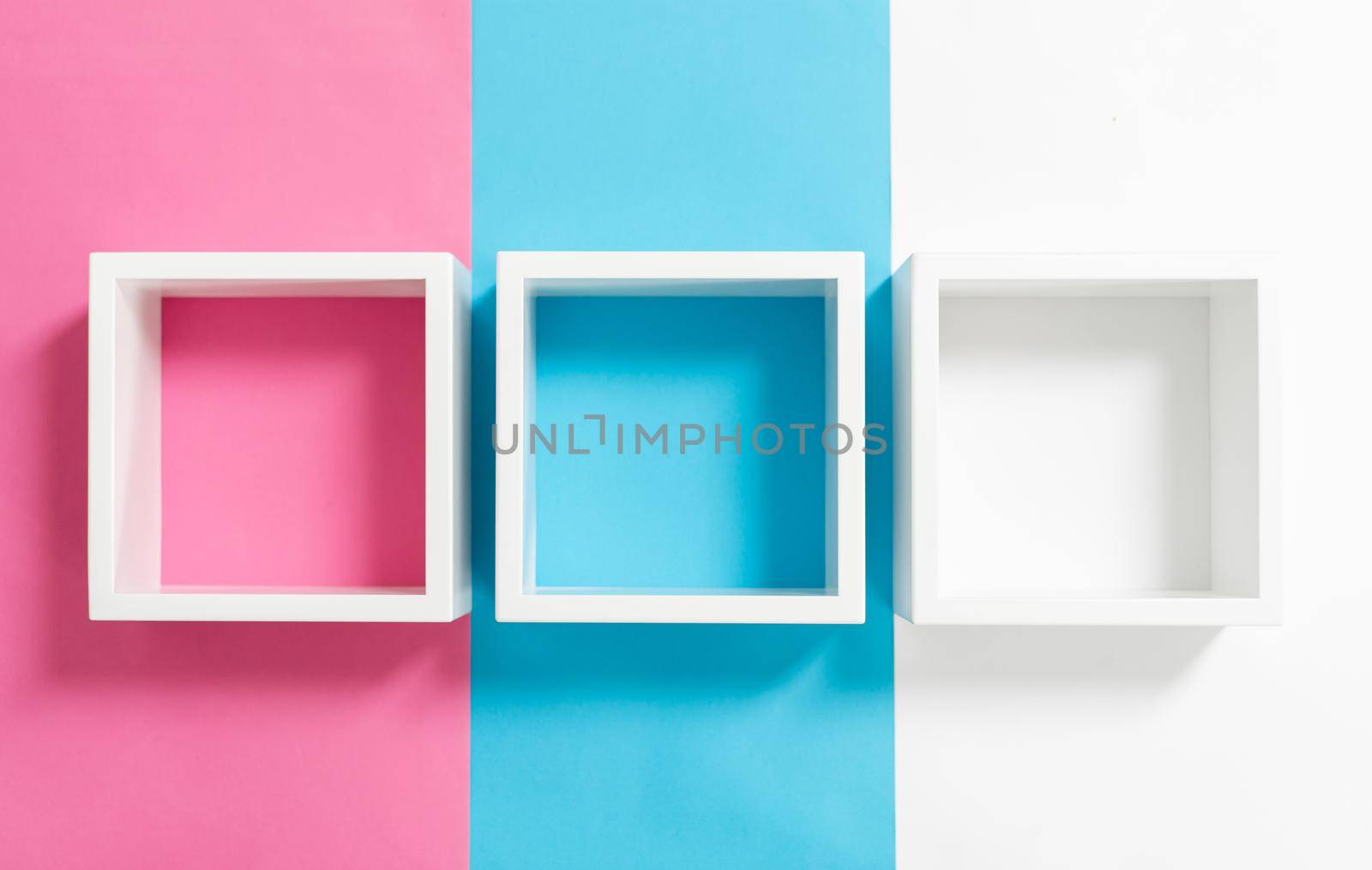 Simply design with empty blue frame isolated on pink and blue pastel colorful background. Top view, flat lay, copy space, mock up.