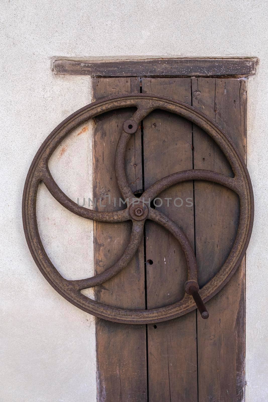 medieval manual crank on wooden door. High quality photo