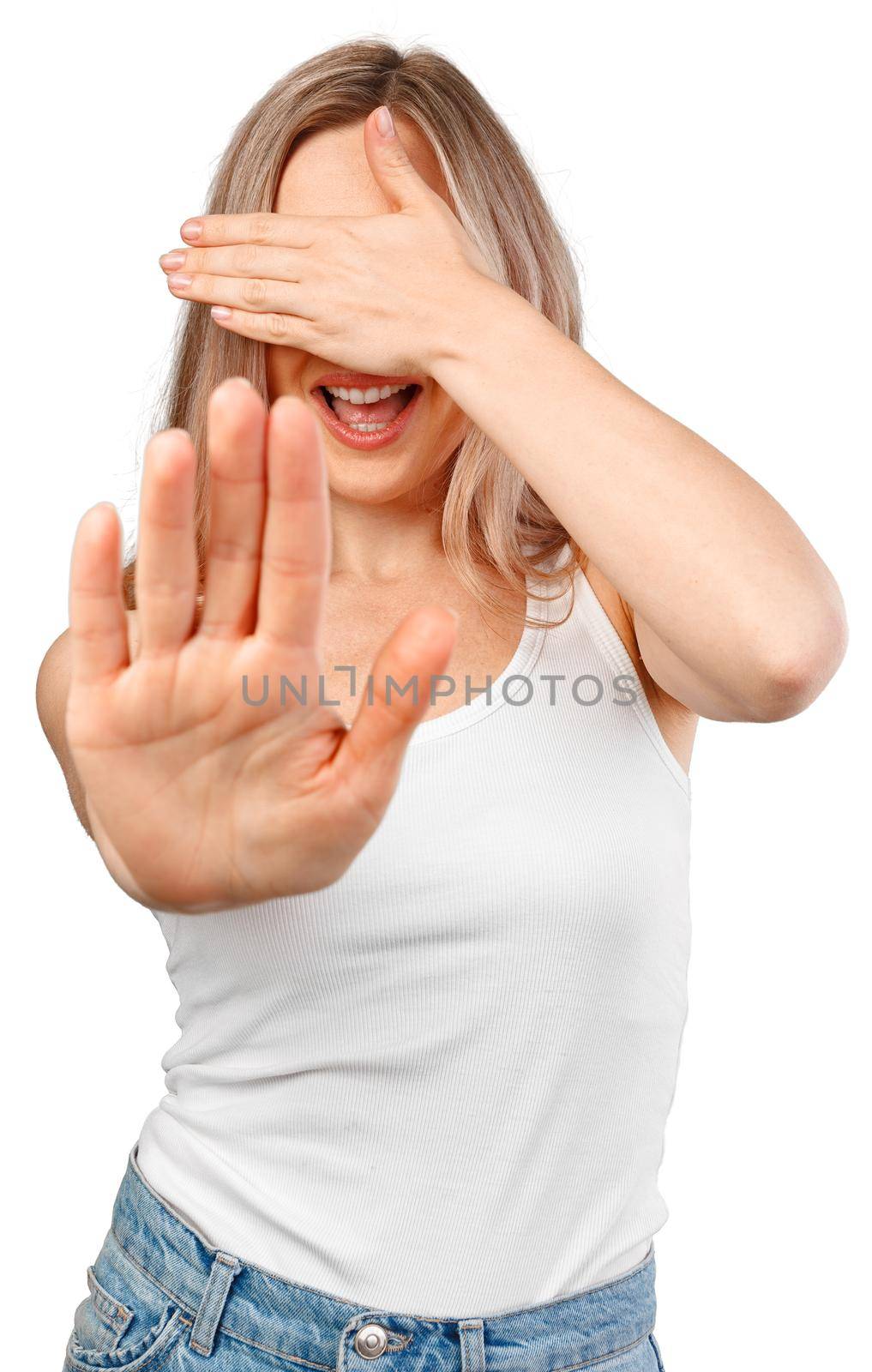 Young beautiful blonde woman covering eyes with hands and doing stop gesture isolated on white background