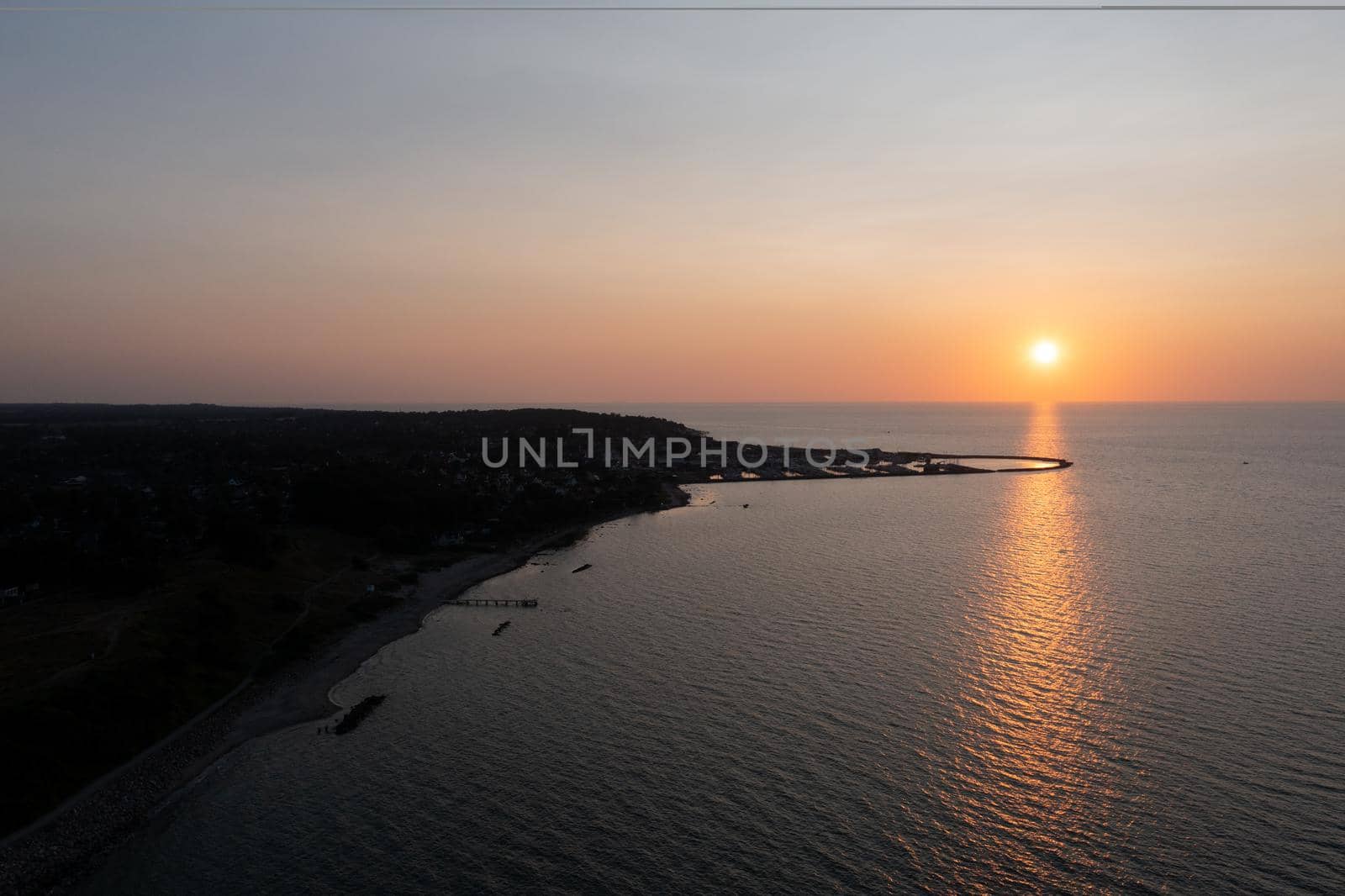 Gilleleje, Denmark - July 23, 2021: Aerial drone view of the silhouette of the local fishing harbour