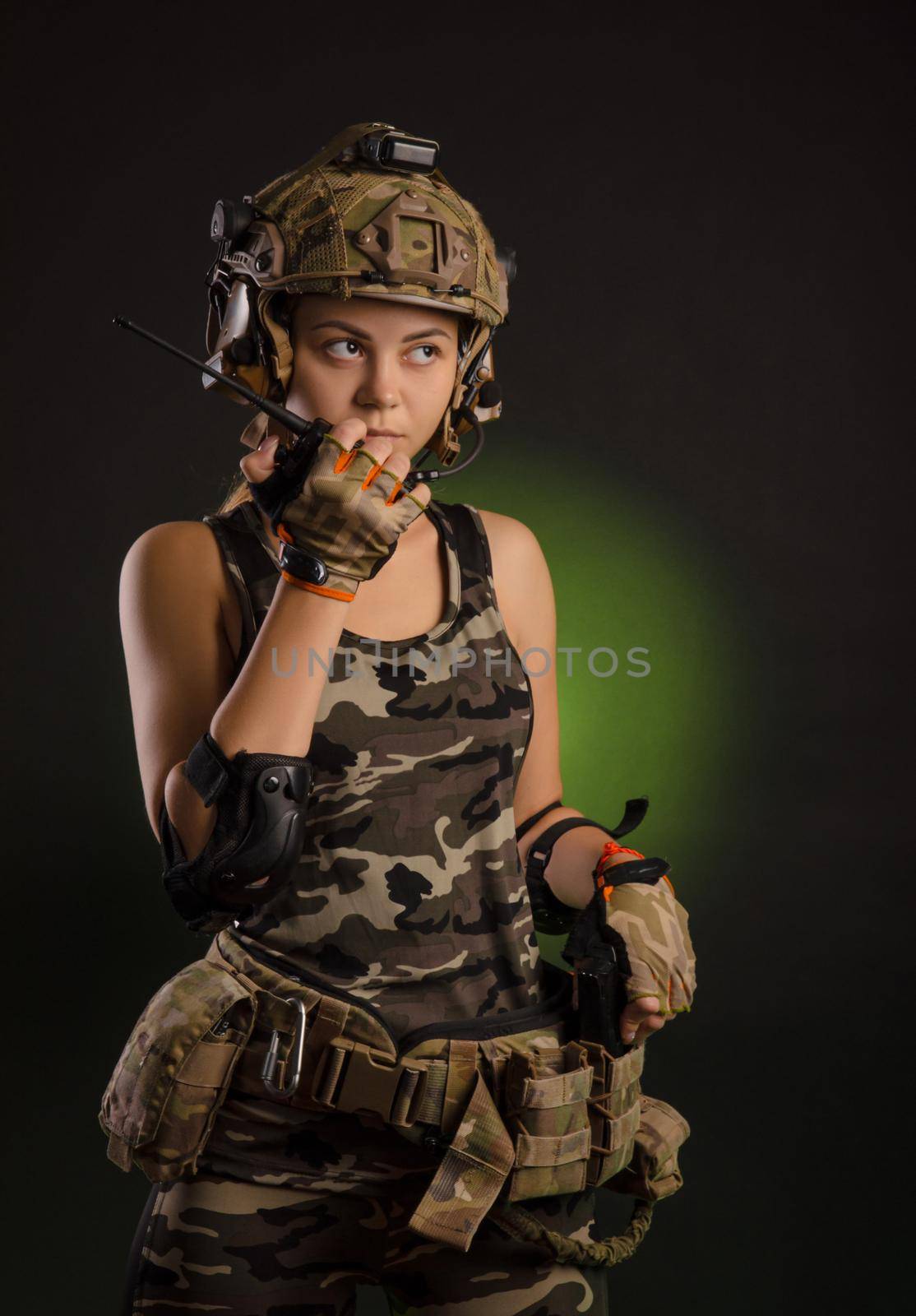 girl in a military uniform helmet says on the radio